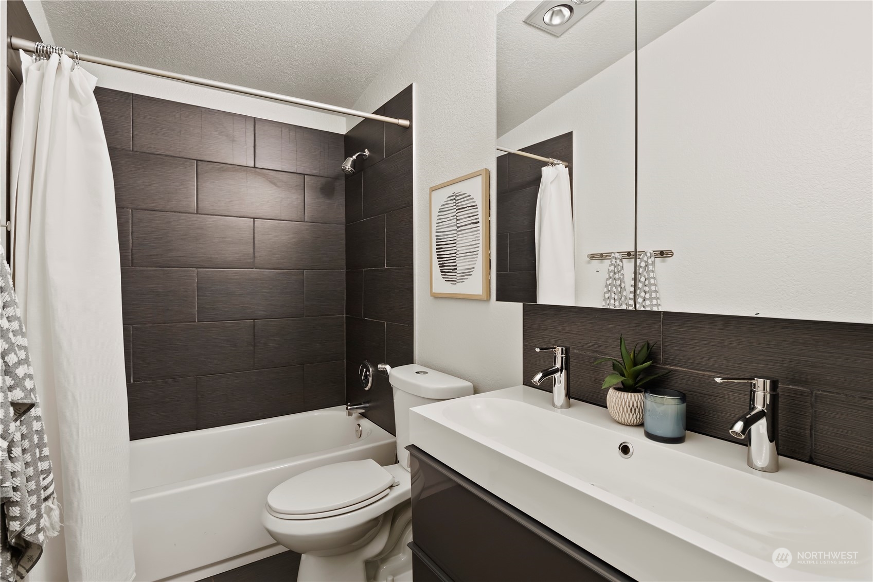 21820 3rd Drive Southeast Bothell, WA 98021 - Photo 16 of 25 a bathroom with a sink a toilet and shower