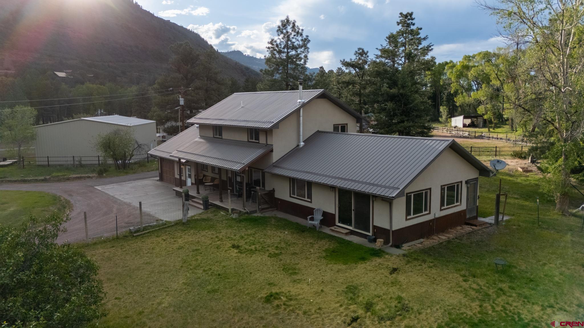 559 Suzanne Lane Ridgway, CO 81432 - Photo 39 of 45 a aerial view of a house with a yard table and chairs