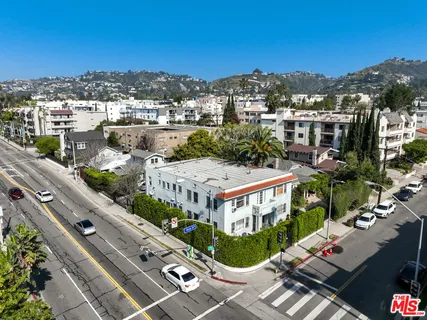 an aerial view of a house with outdoor space