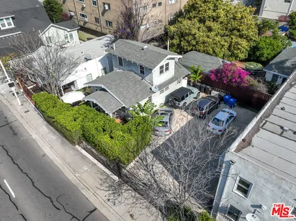 an aerial view of a house with a garden
