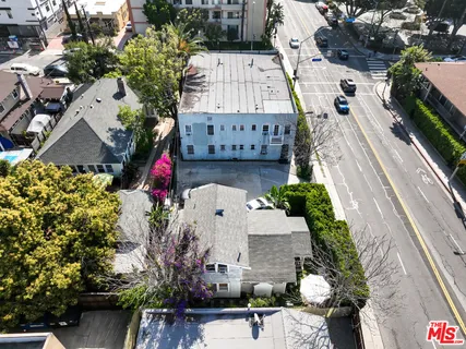 an aerial view of a house with a garden