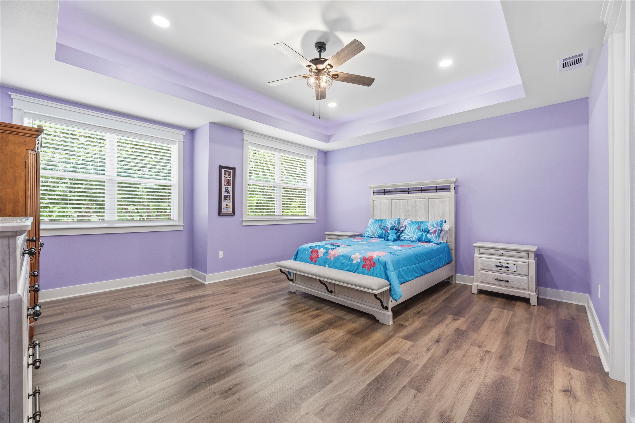4607 Clayhead Road Richmond, TX 77406 - Photo 30 of 49 Thoughtfully designed bedroom featuring elegant tray ceilings and a calm contemporary aesthetic.