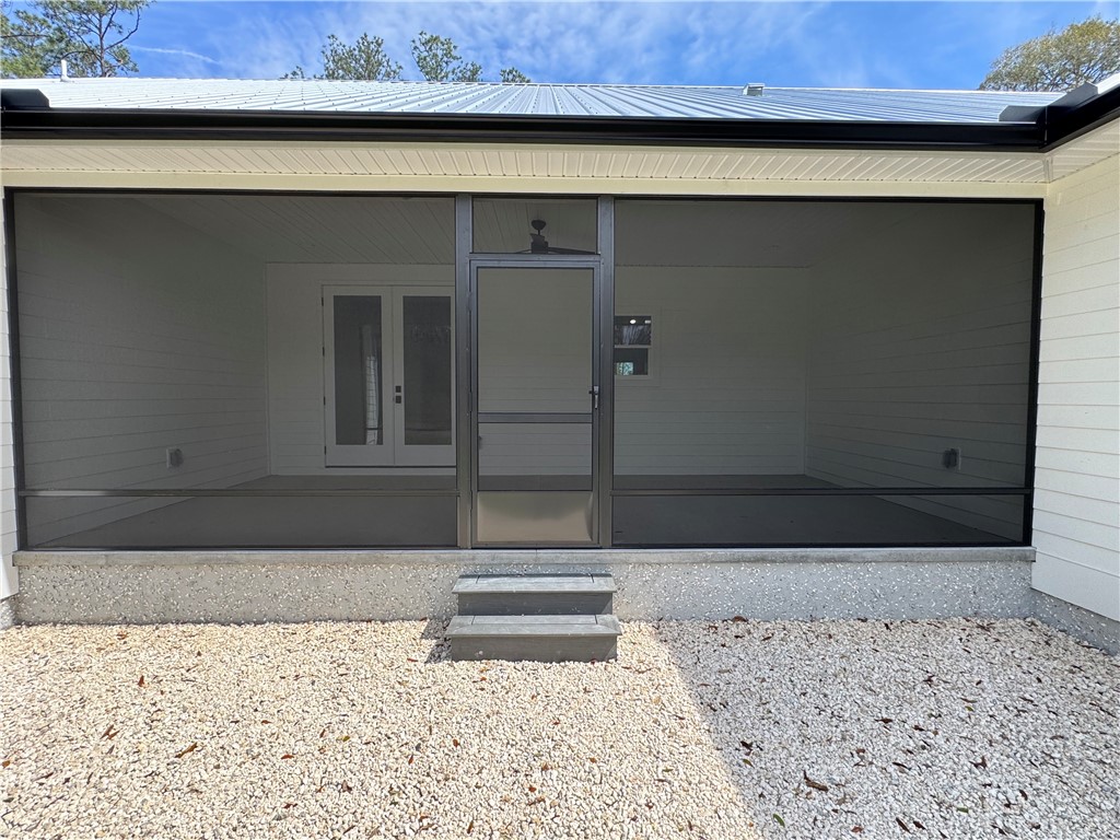 194 Piney Bluff Road Waverly, GA 31565 - Photo 6 of 36 Screened Back Porch Outside View