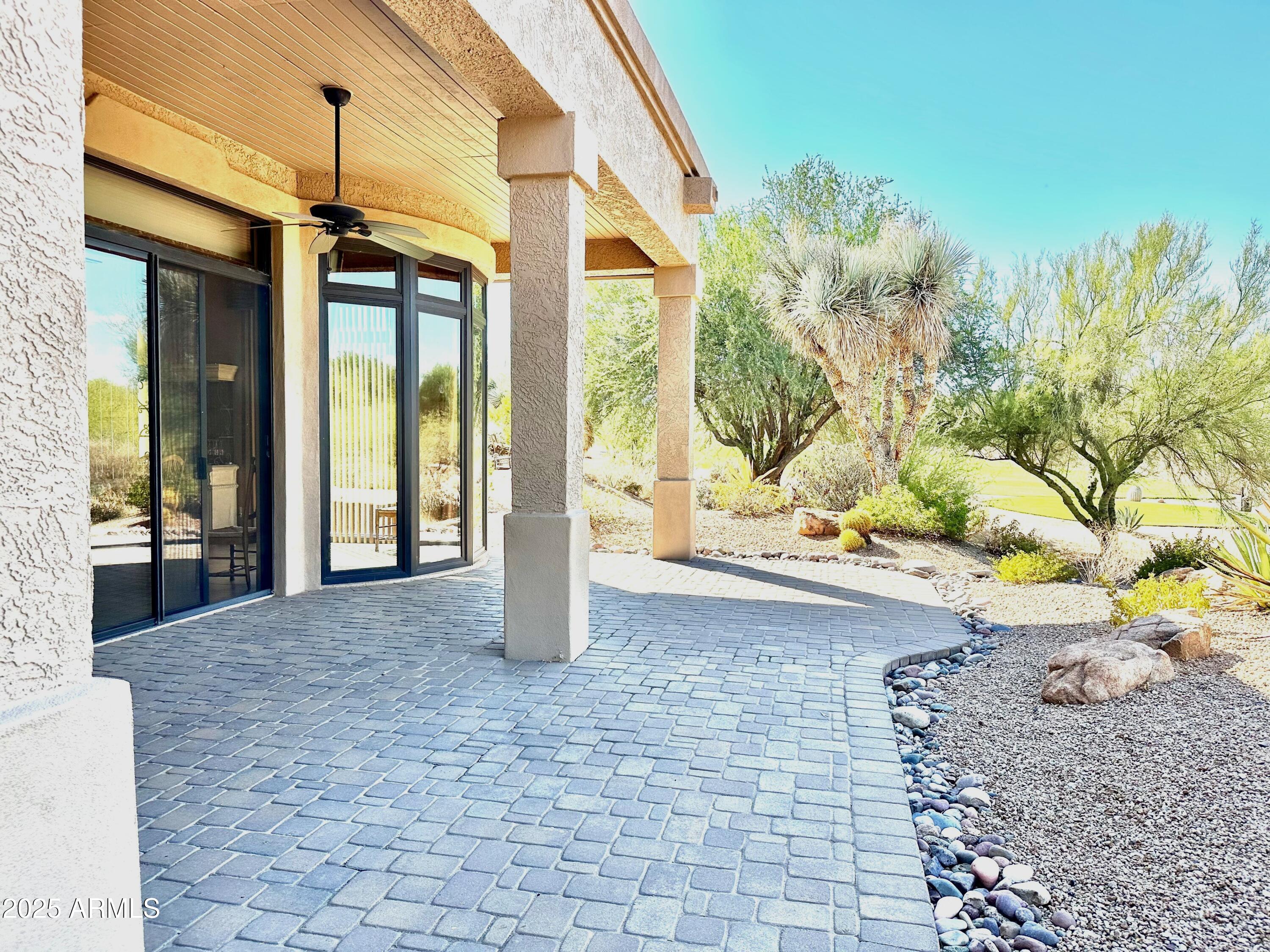 18626 Amarado Circle Rio Verde, AZ 85263 - Photo 12 of 19 a view of a porch with a floor to ceiling window and potted plants
