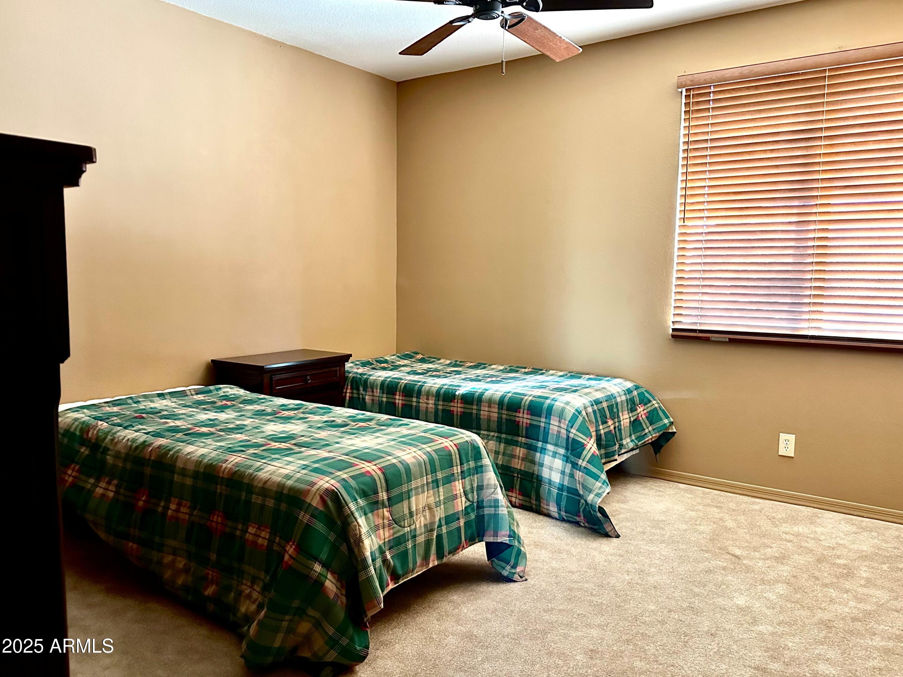 18626 Amarado Circle Rio Verde, AZ 85263 - Photo 9 of 19 a bedroom with two beds and lamp