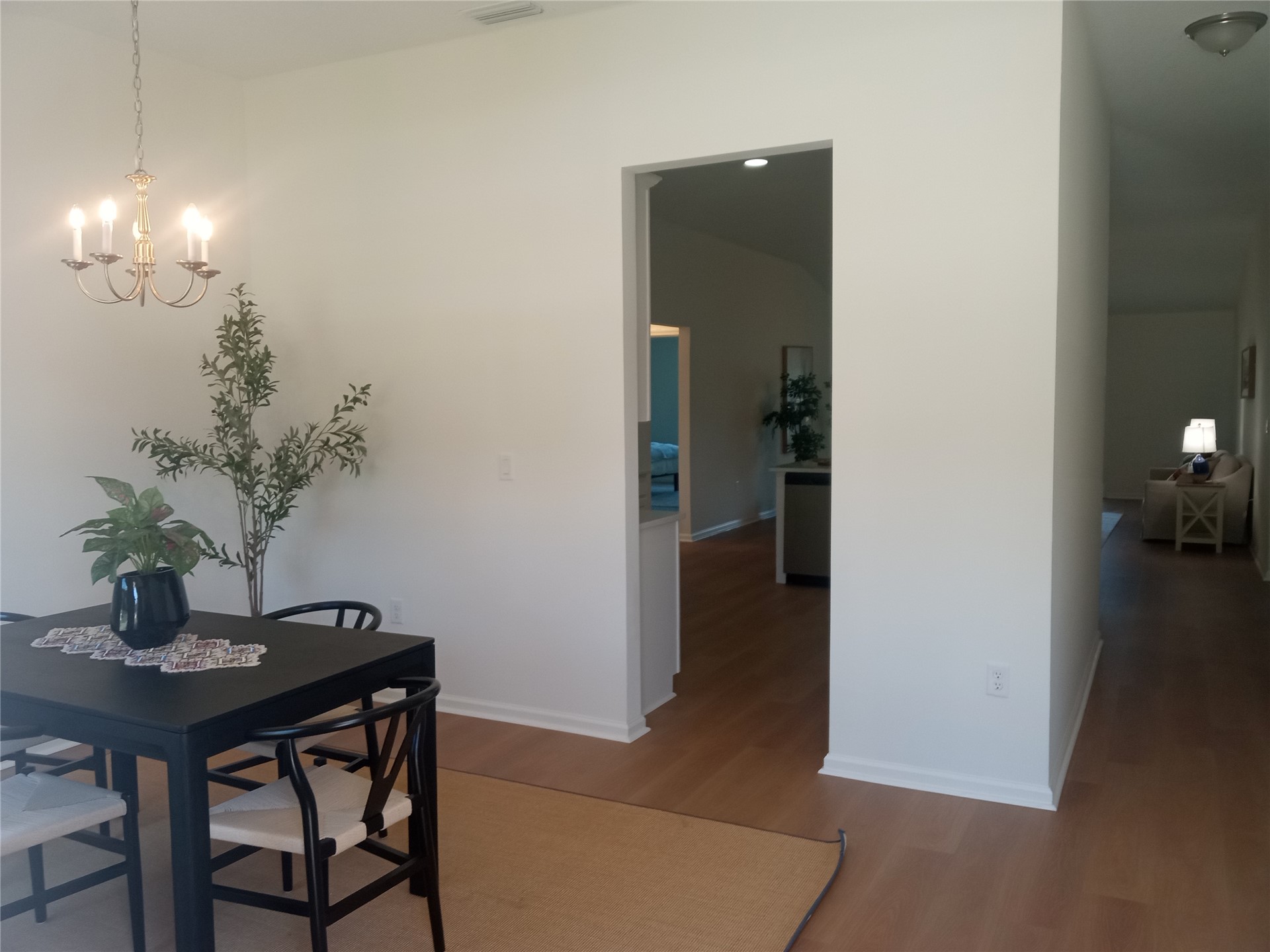 96052 Pirates Bluff Road Yulee, FL 32097 - Photo 18 of 22 a view of a dining room with furniture and wooden floor