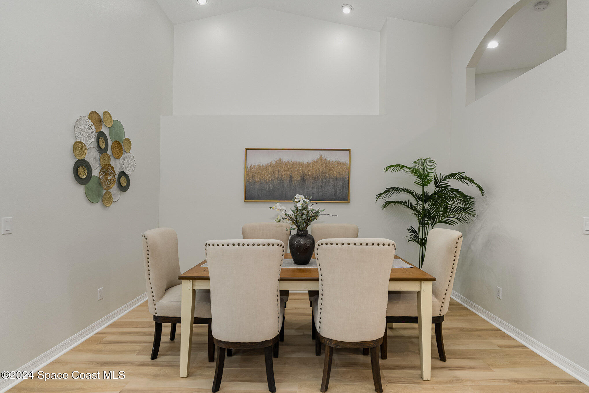 511 Shell Cove Drive Melbourne, FL 32940 - Photo 11 of 31 a view of a dining room with furniture and wooden floor
