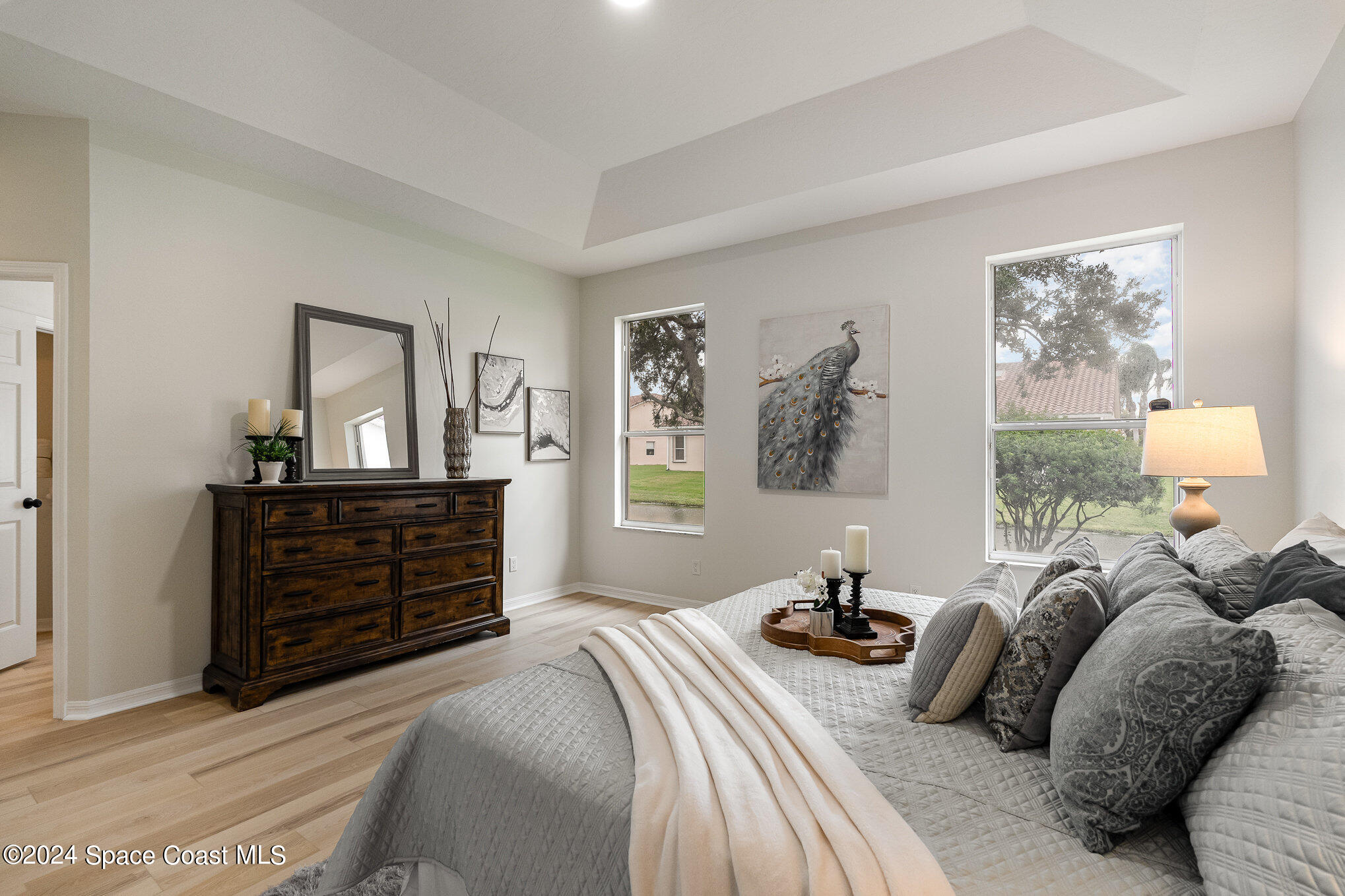 511 Shell Cove Drive Melbourne, FL 32940 - Photo 14 of 31 a bedroom with a bed and a dresser