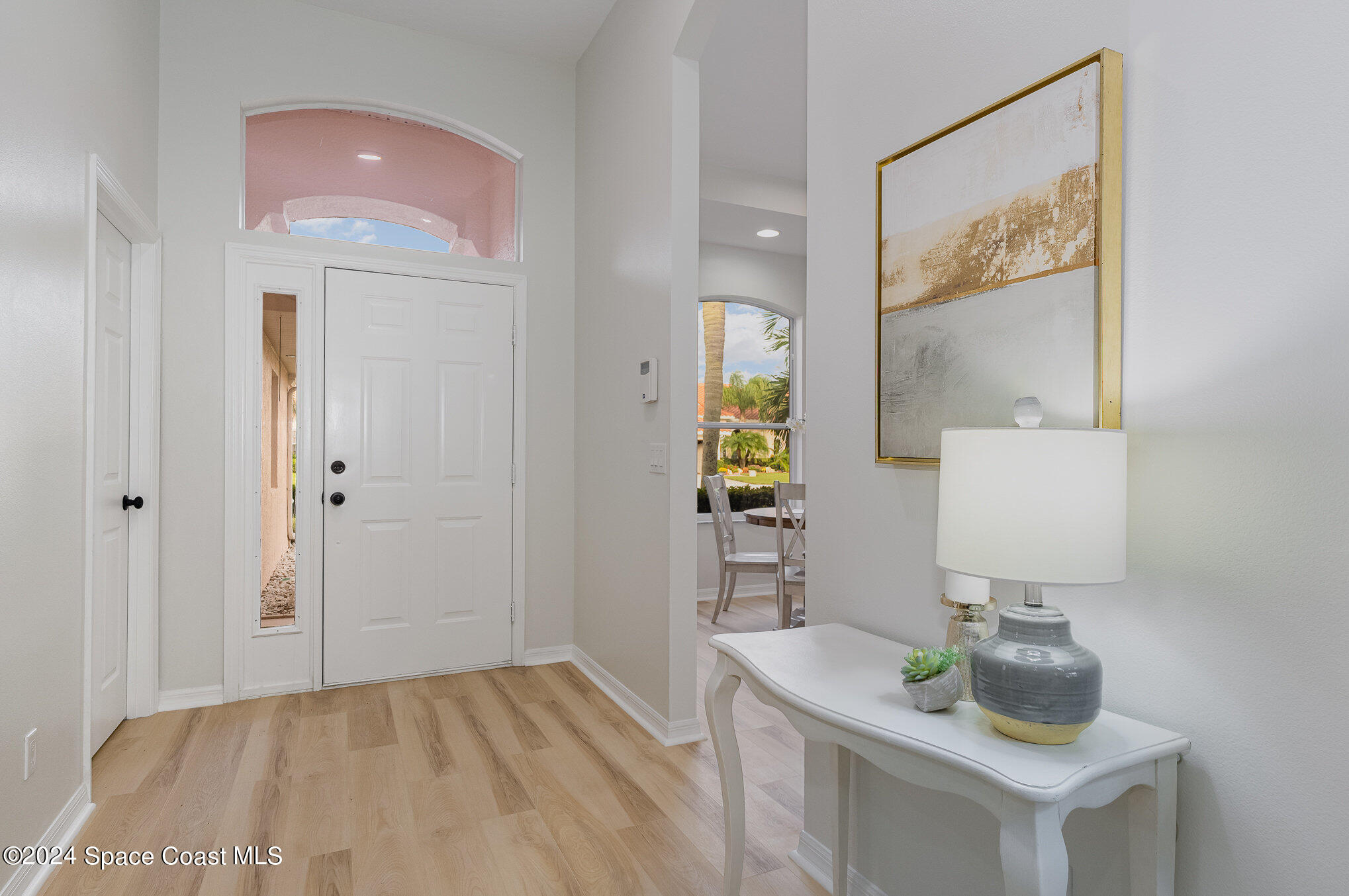 511 Shell Cove Drive Melbourne, FL 32940 - Photo 3 of 31 a bathroom with a sink and a mirror