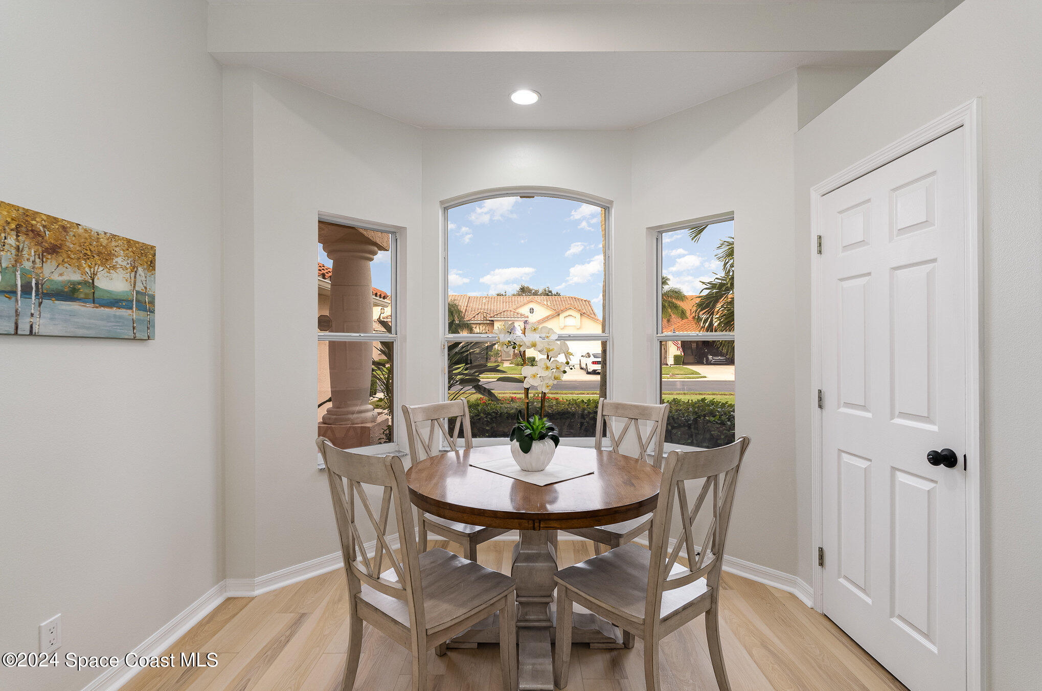 511 Shell Cove Drive Melbourne, FL 32940 - Photo 9 of 31 a view of a dining room with furniture window and wooden floor