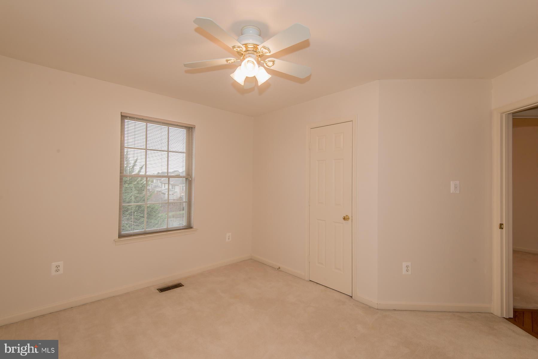 2405 Rippling Brook Road Frederick, MD 21701 - Photo 22 of 30 an empty room with windows and fan