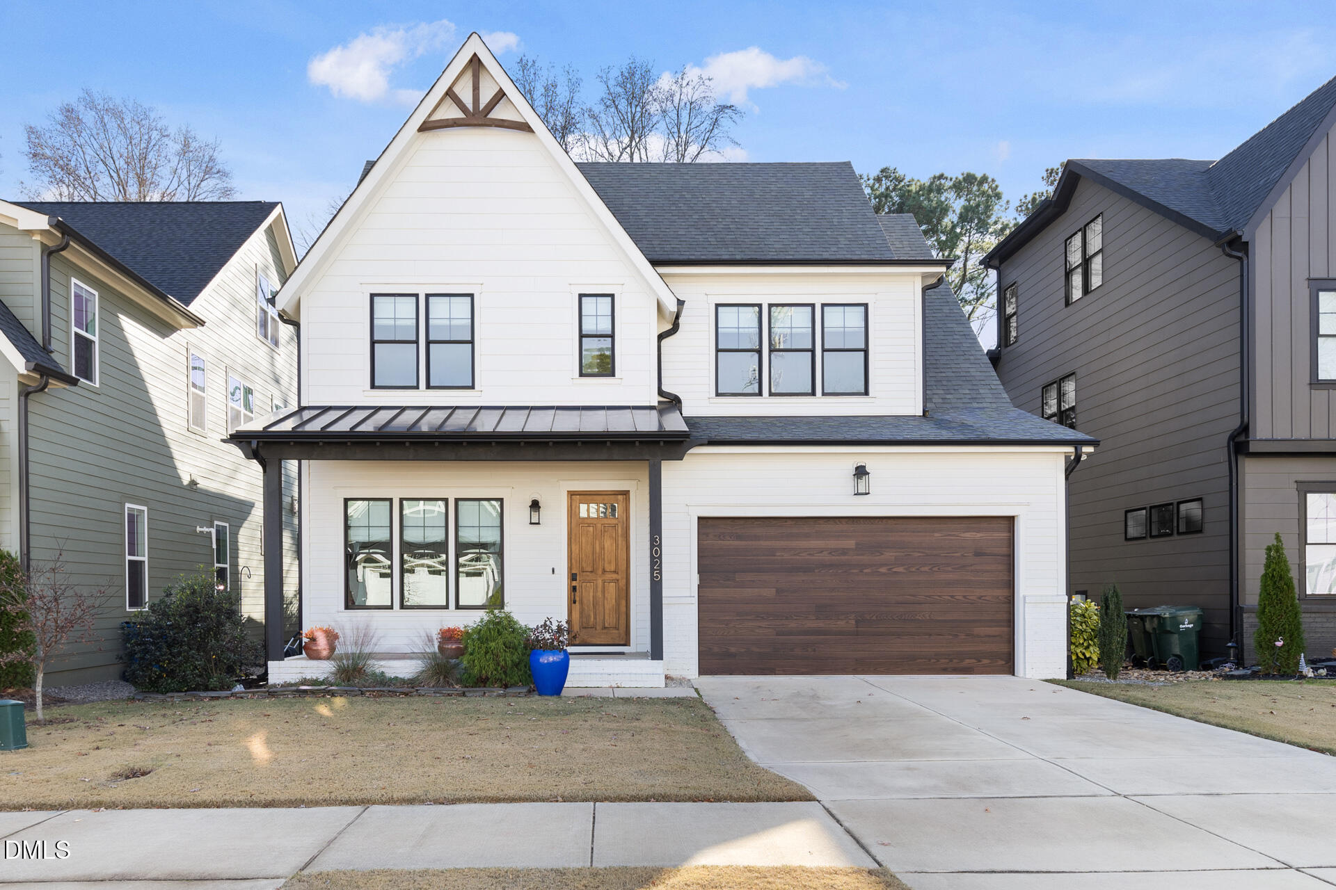 3025 Eden Harbor Court Raleigh, NC 27613 - Photo 1 of 44 a view of a white house with large windows and a fireplace