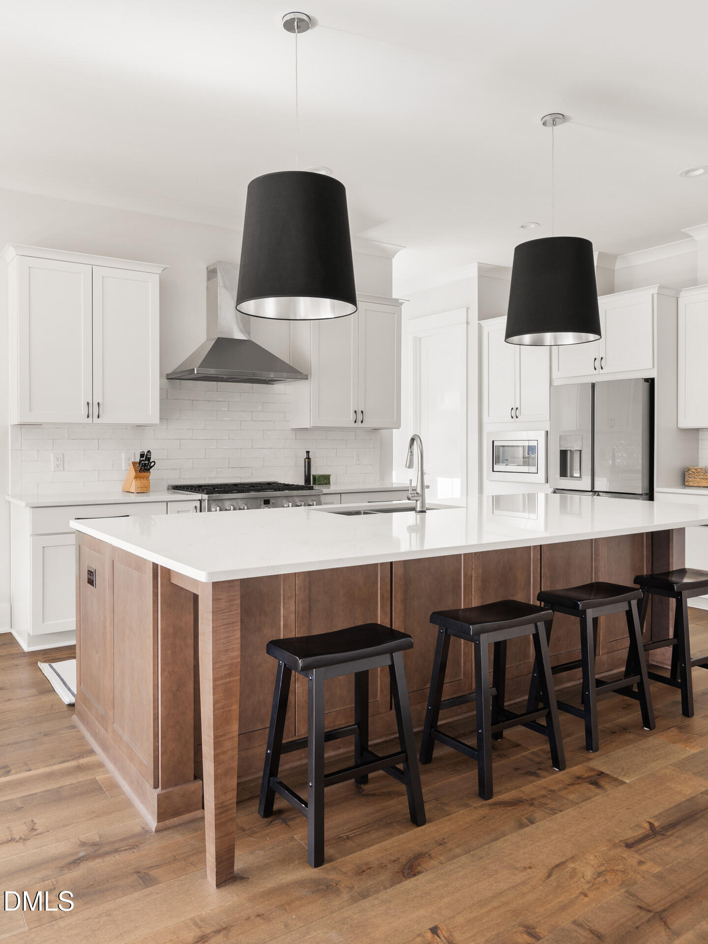 3025 Eden Harbor Court Raleigh, NC 27613 - Photo 11 of 44 a kitchen with a table chairs sink and cabinets