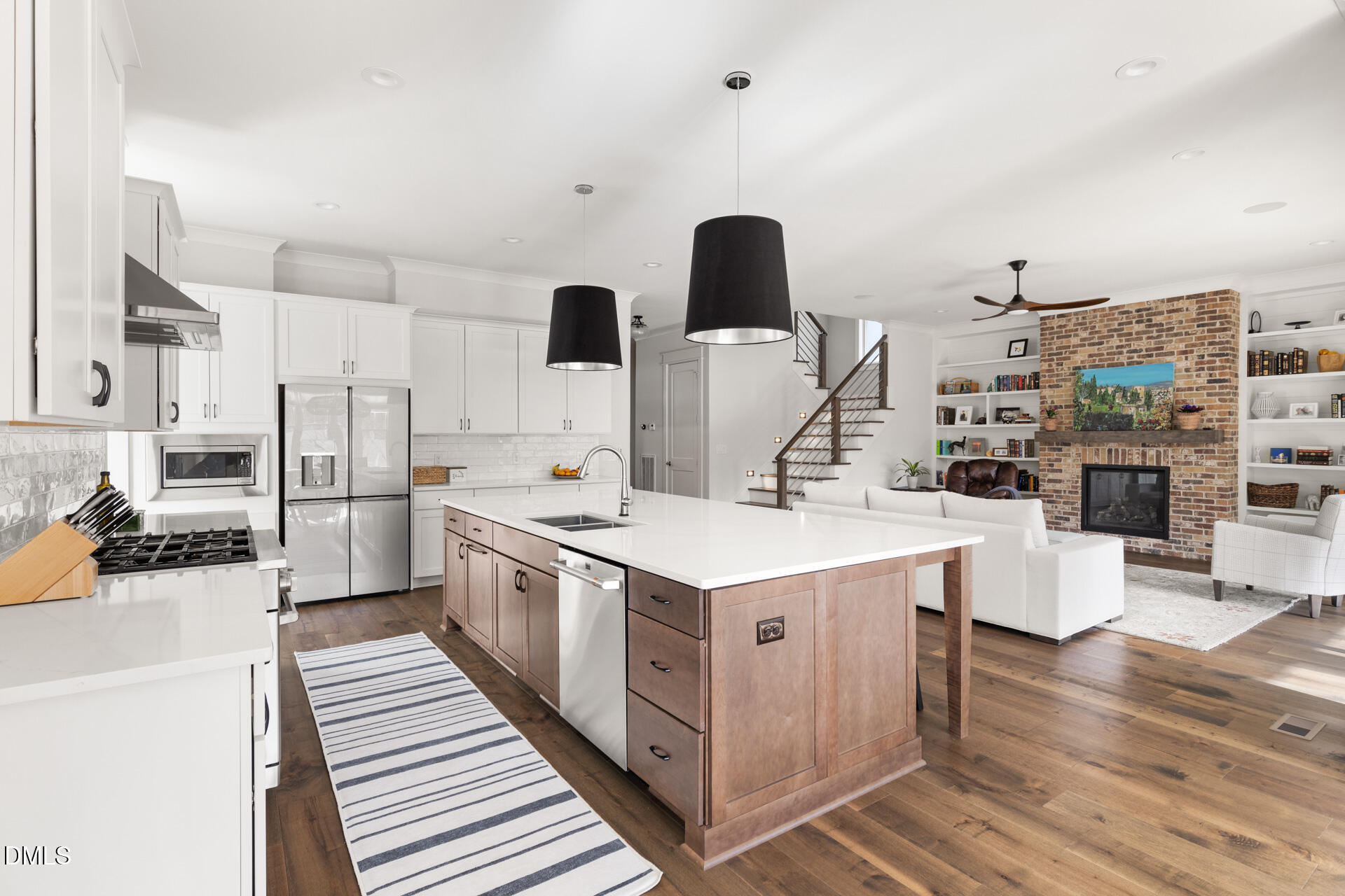 3025 Eden Harbor Court Raleigh, NC 27613 - Photo 13 of 44 a kitchen with stainless steel appliances a sink stove and wooden floor