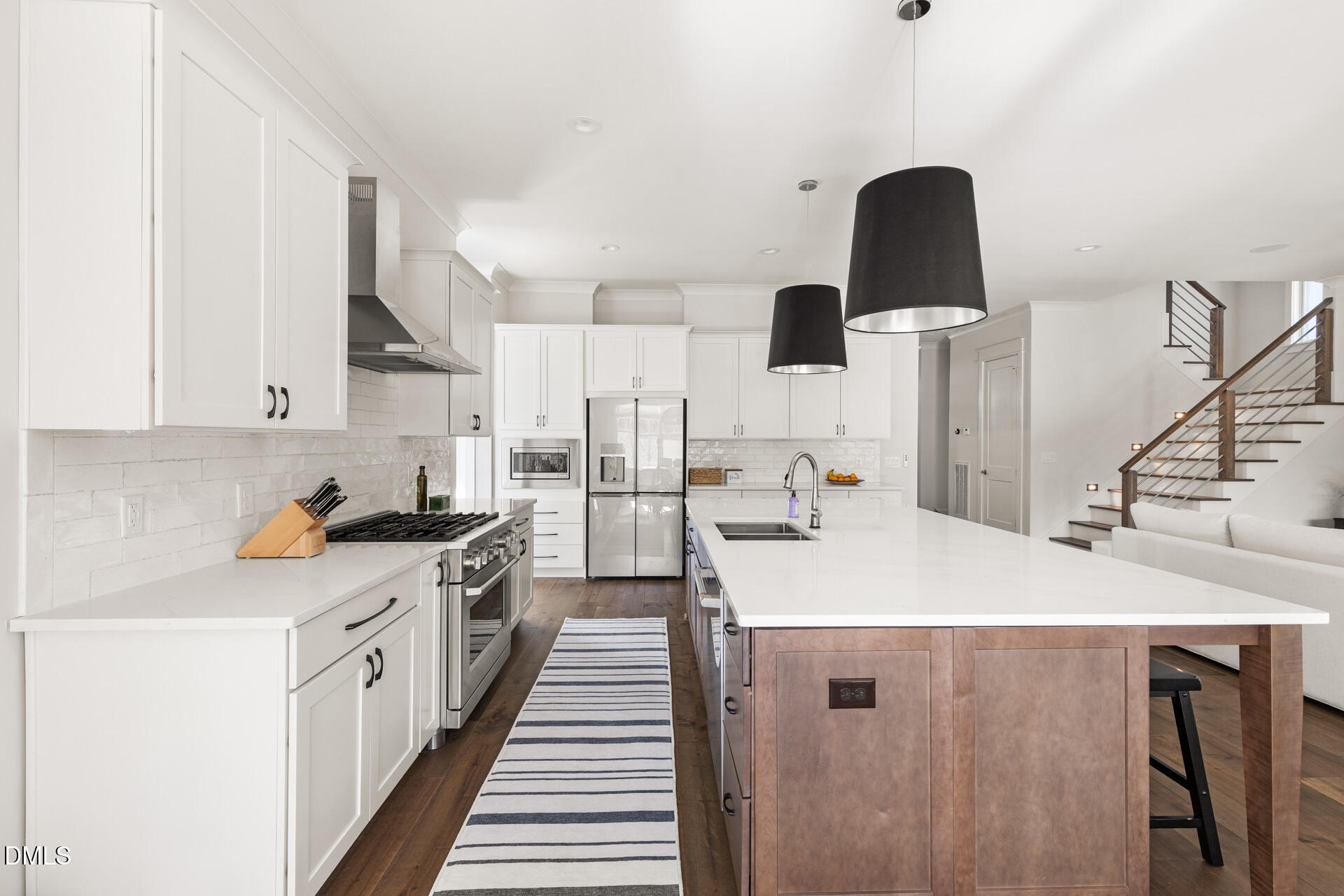 3025 Eden Harbor Court Raleigh, NC 27613 - Photo 15 of 44 a kitchen with stainless steel appliances a sink a stove and a wooden floor
