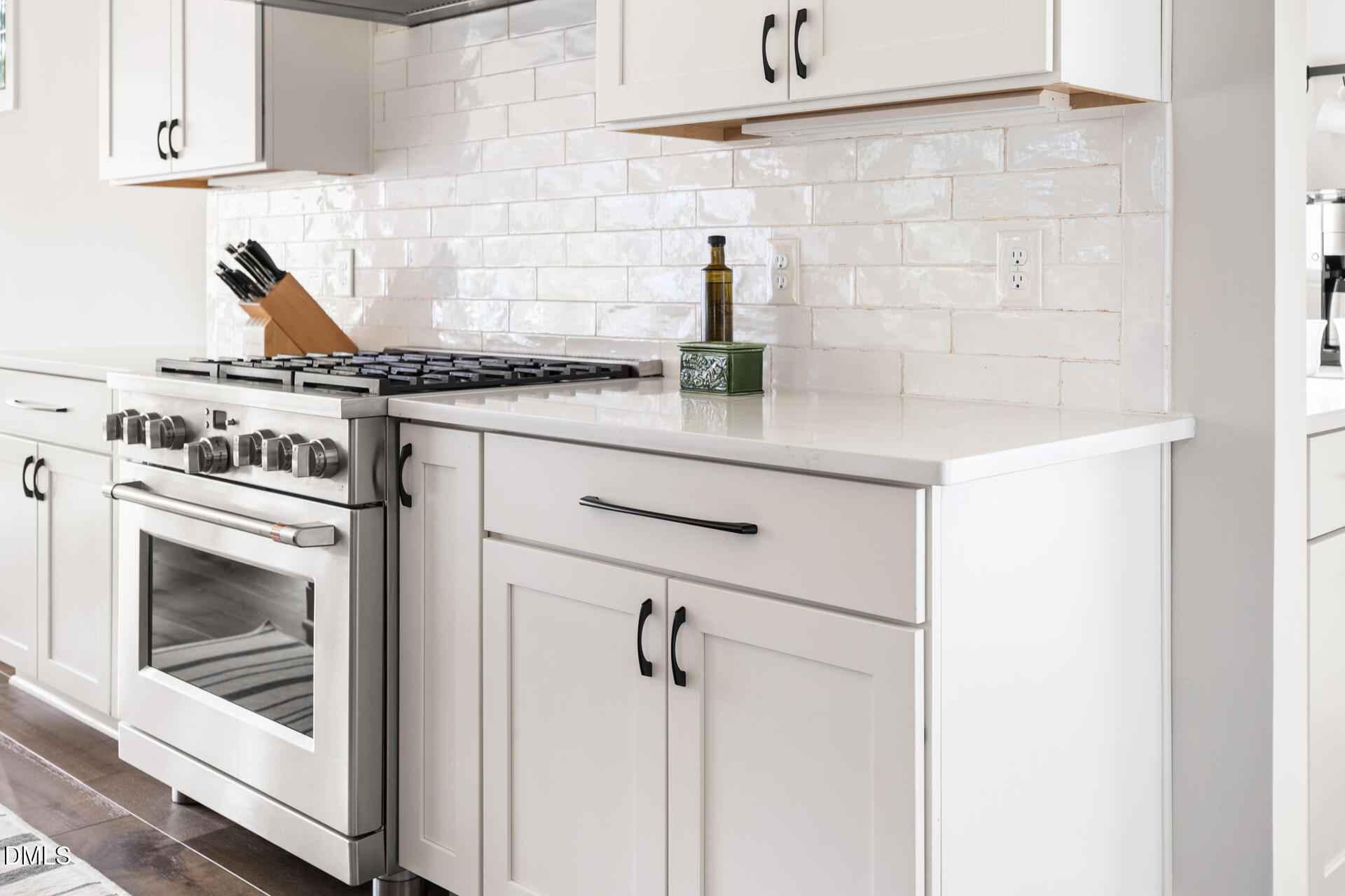 3025 Eden Harbor Court Raleigh, NC 27613 - Photo 17 of 44 a kitchen with a stove and cabinets