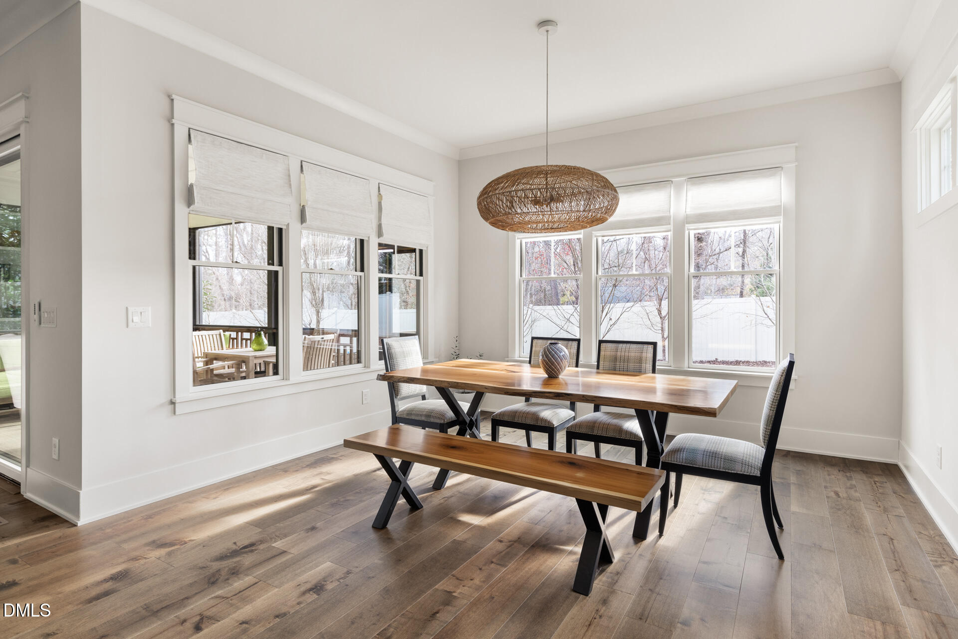 3025 Eden Harbor Court Raleigh, NC 27613 - Photo 21 of 44 a view of a dining room with furniture window and wooden floor