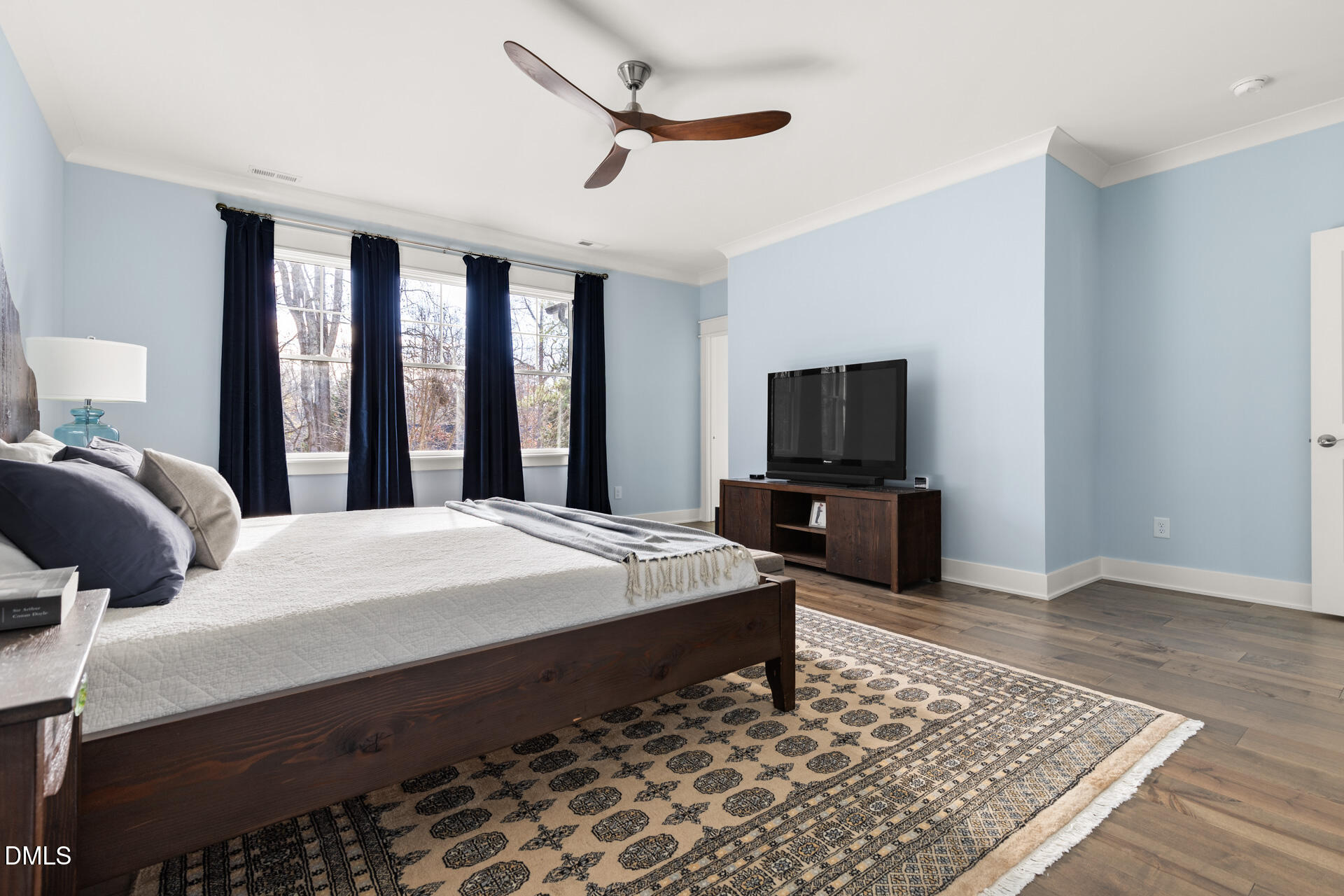 3025 Eden Harbor Court Raleigh, NC 27613 - Photo 23 of 44 a bedroom with a bed and a flat screen tv