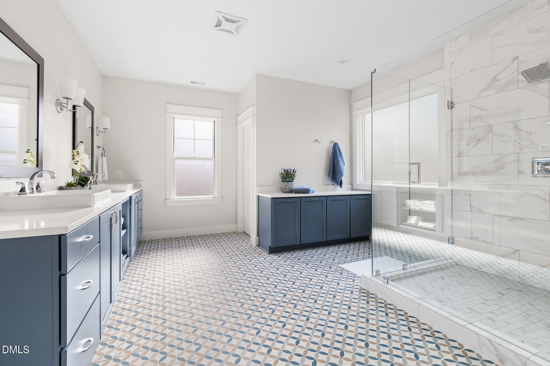 3025 Eden Harbor Court Raleigh, NC 27613 - Photo 25 of 44 a view of a bathroom with a sink a toilet a mirror and a tub