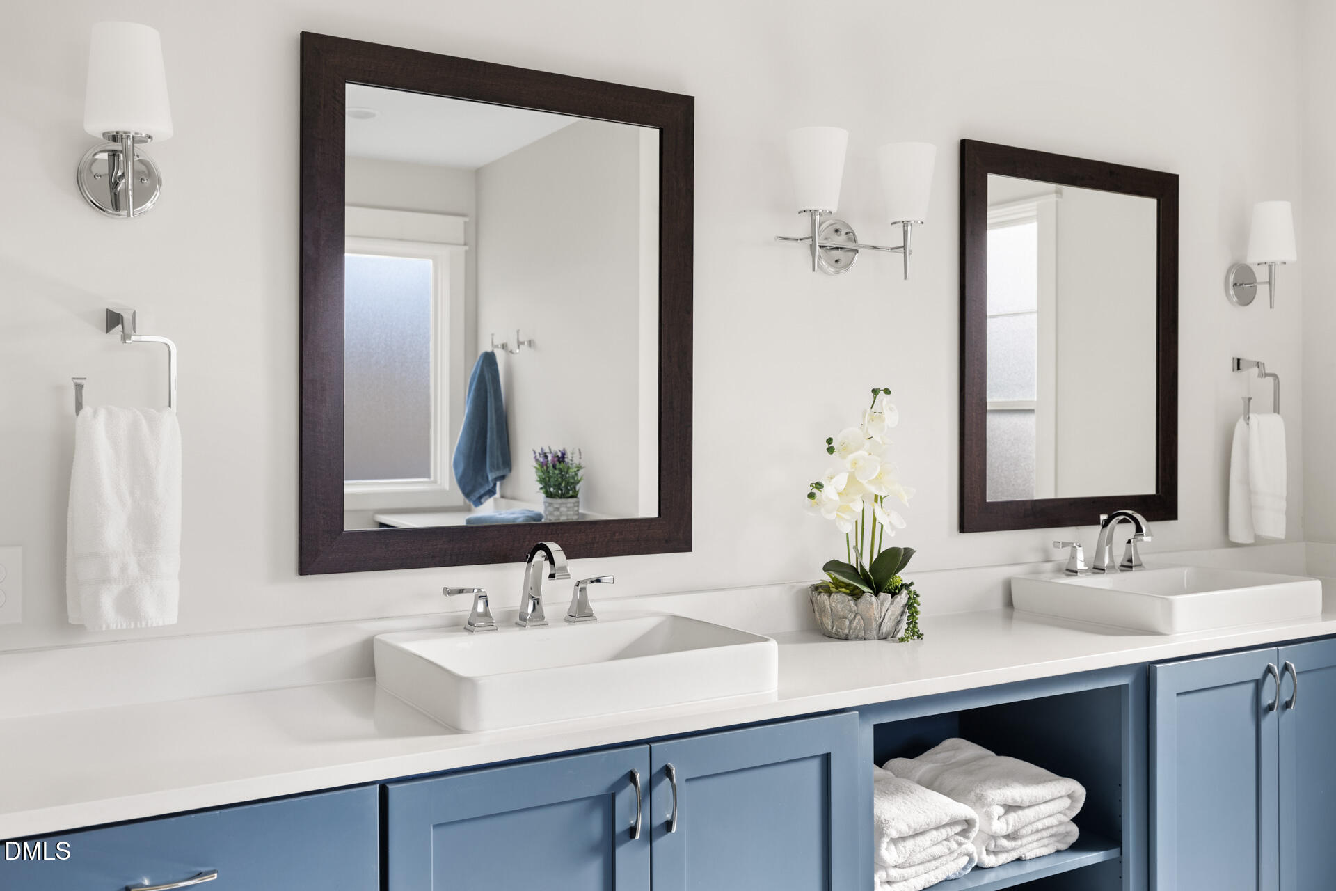 3025 Eden Harbor Court Raleigh, NC 27613 - Photo 27 of 44 a bathroom with double sink and a mirror