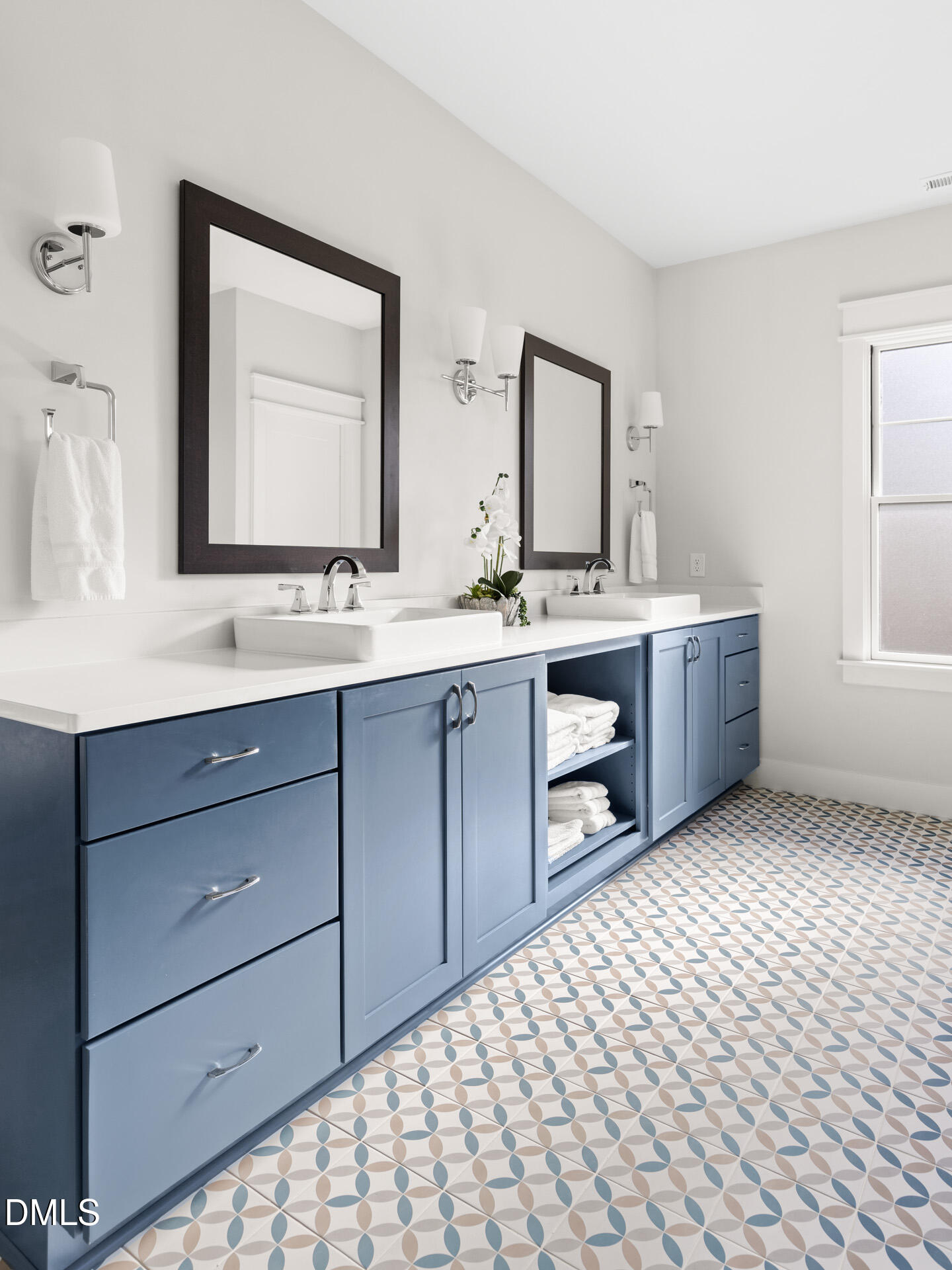 3025 Eden Harbor Court Raleigh, NC 27613 - Photo 28 of 44 a room with a double vanity sink mirror and window