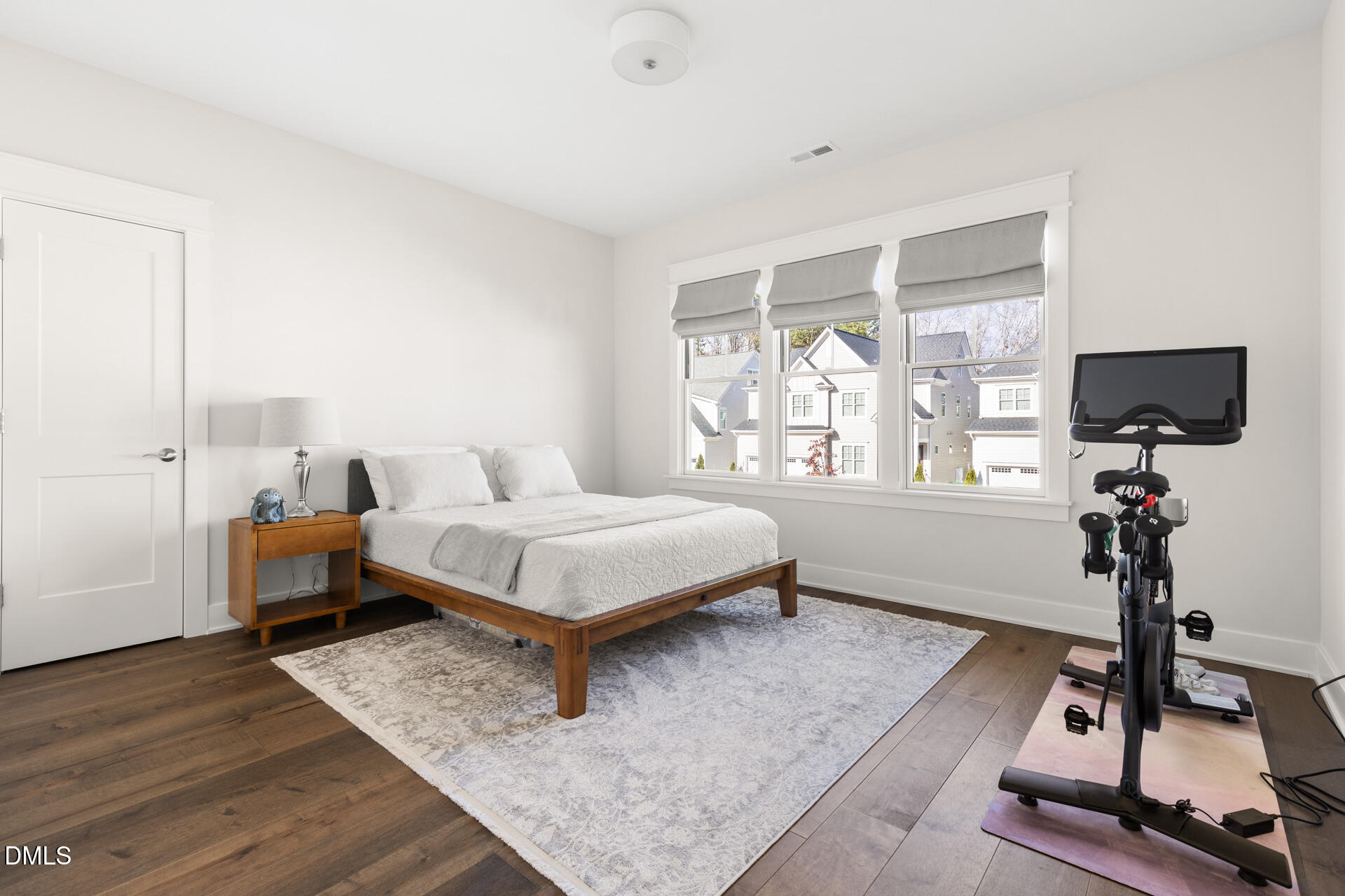 3025 Eden Harbor Court Raleigh, NC 27613 - Photo 29 of 44 a bedroom with a bed window and flat screen tv