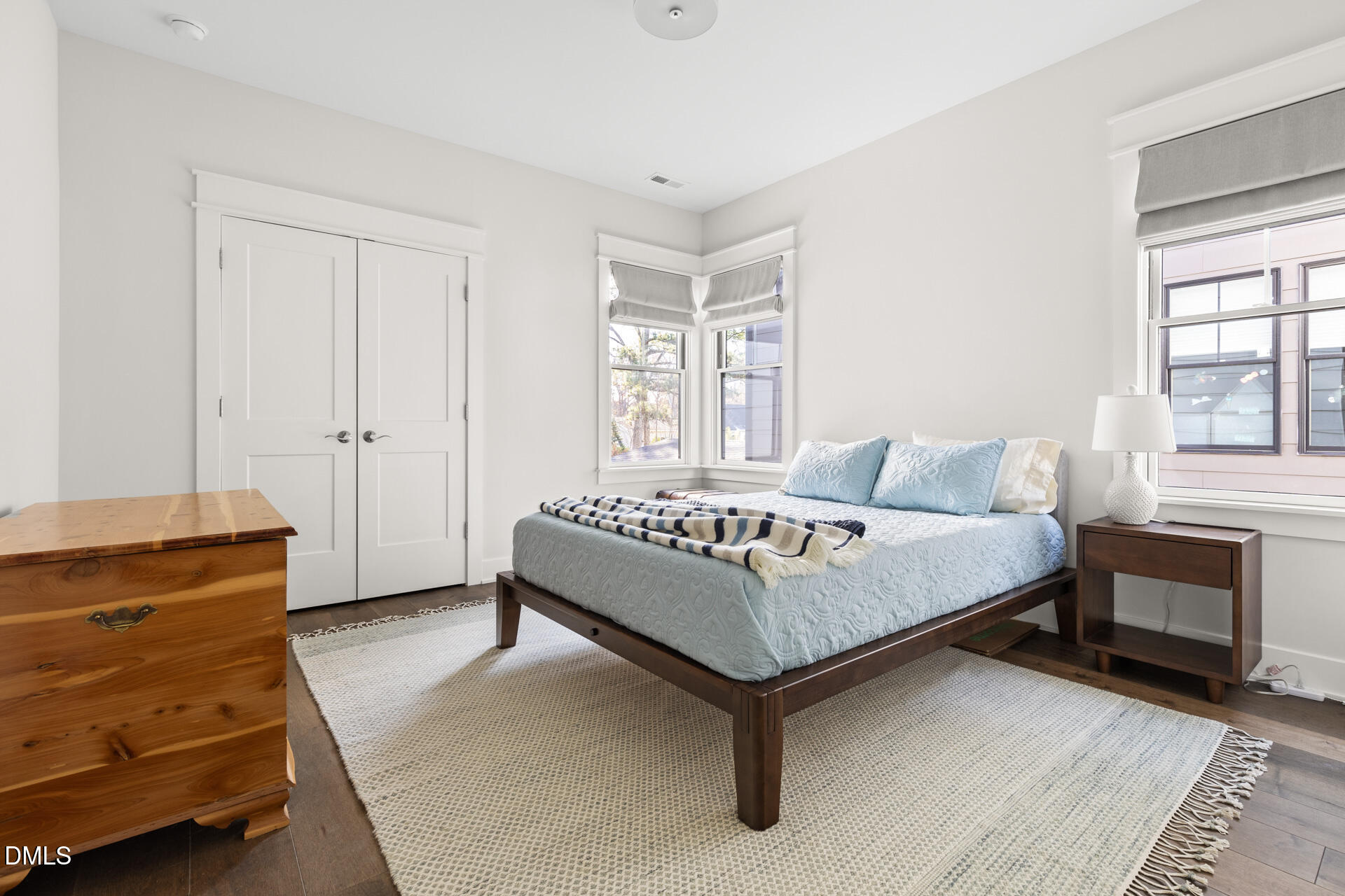 3025 Eden Harbor Court Raleigh, NC 27613 - Photo 30 of 44 a bedroom with a bed and a dresser next to a window