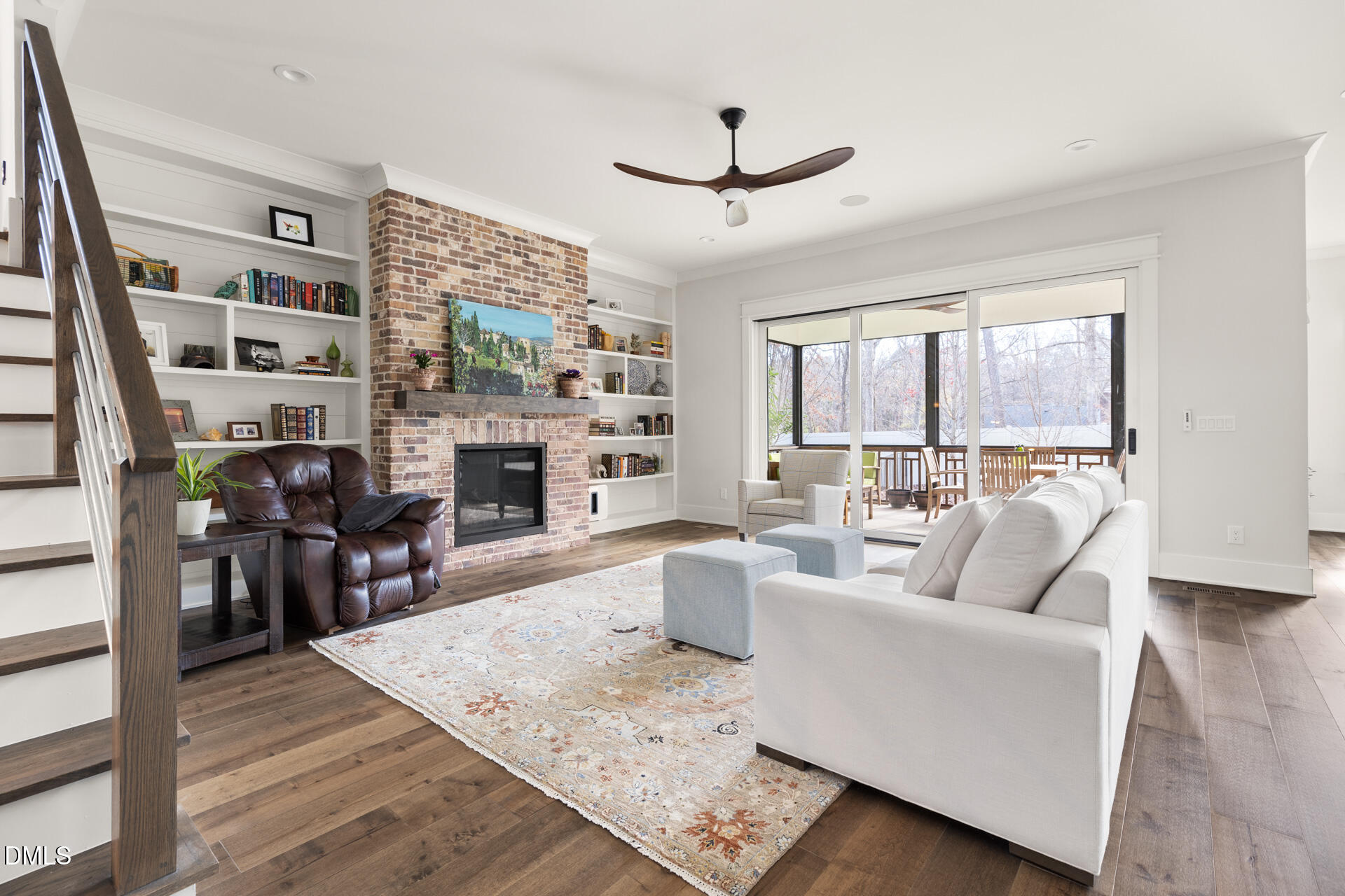 3025 Eden Harbor Court Raleigh, NC 27613 - Photo 7 of 44 a living room with furniture a large window and a fireplace