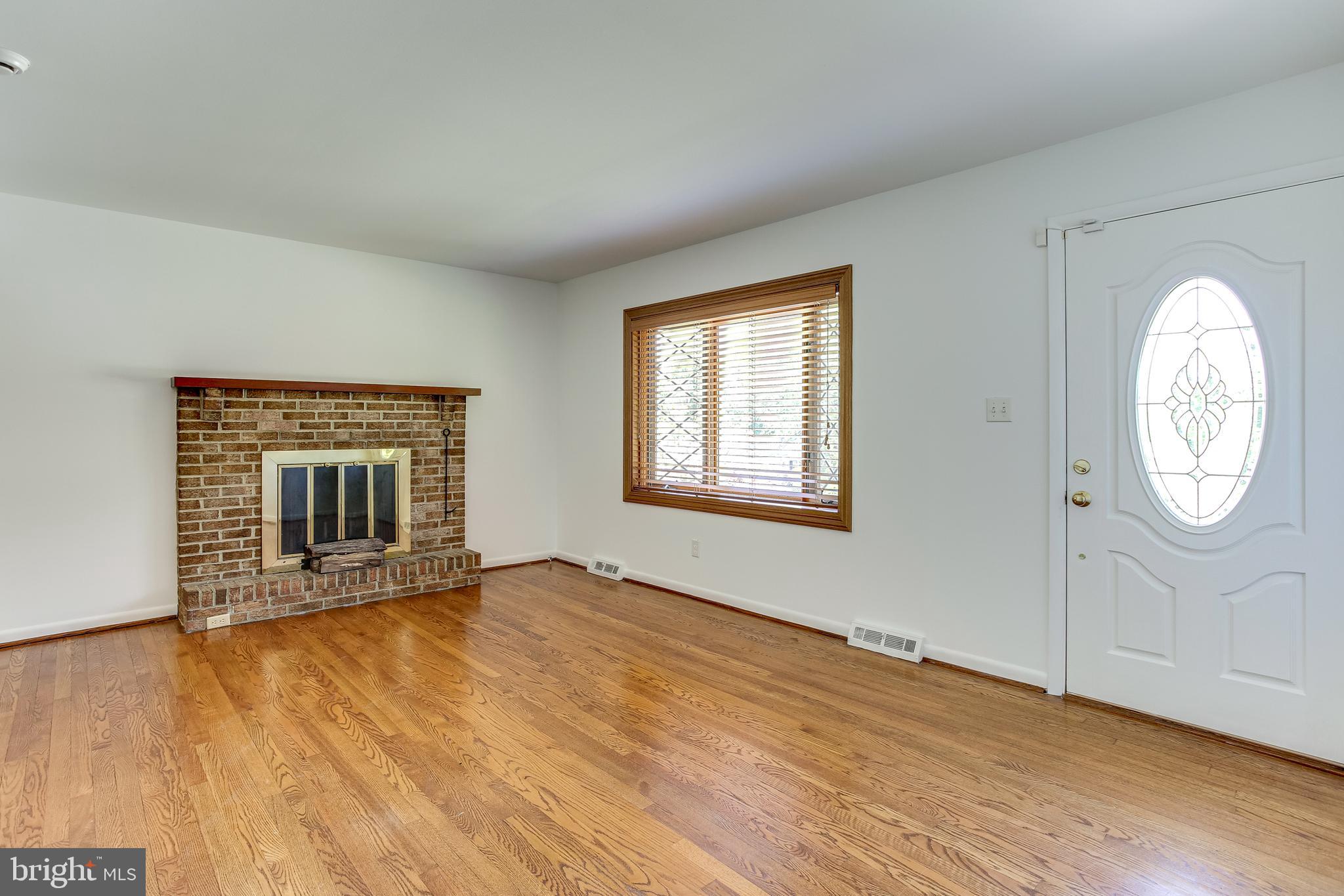 1519 Marsha Road Baltimore, MD 21227 - Photo 3 of 36 Living Room w/ Wood Burning Fireplace