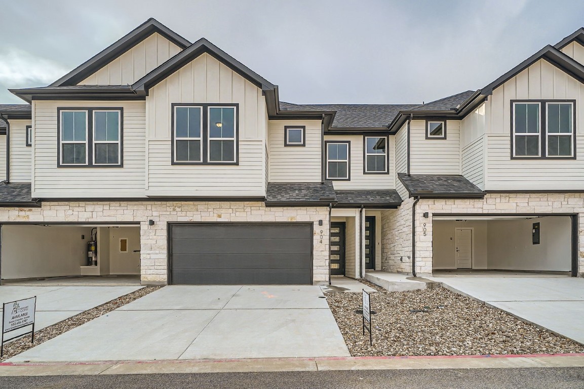 2600 Gattis School Road, Unit 905 Round Rock, TX 78664 - Photo 1 of 1 a front view of a house with a yard and garage