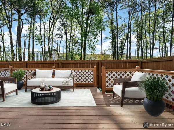 a view of a patio with couches and potted plants