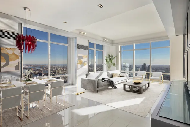 a large room with lots of furniture and a chandelier