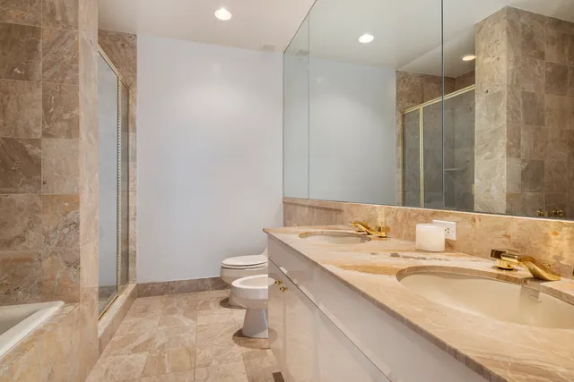 a kitchen with stainless steel appliances granite countertop a sink and a stove