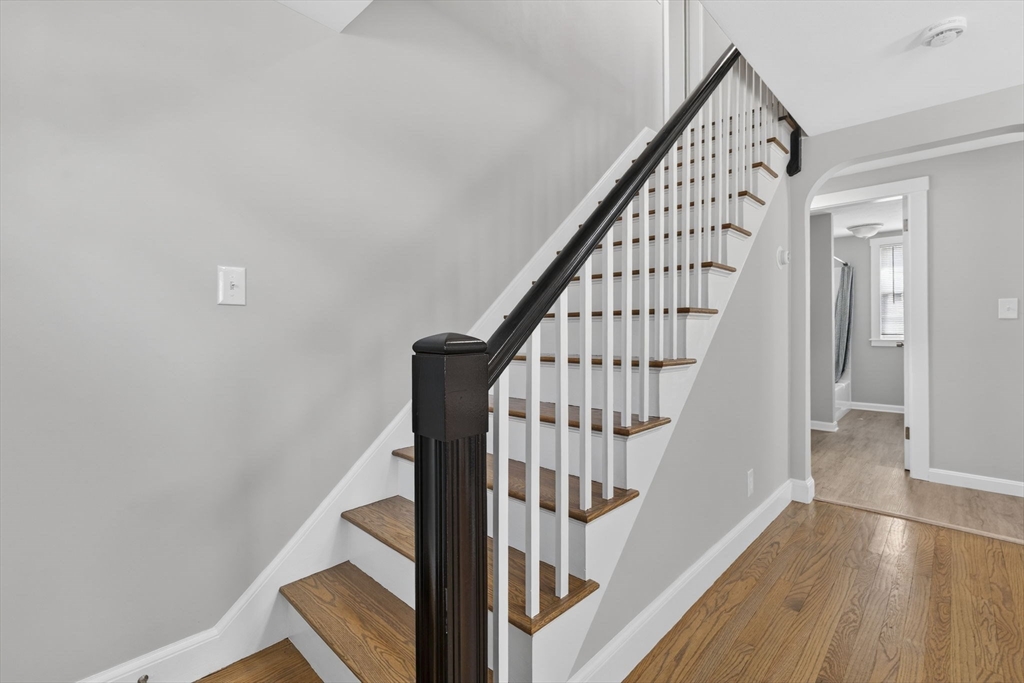 41 Clinton Street Marlborough, MA 01752 - Photo 11 of 26 a view of staircase with wooden floor and white walls