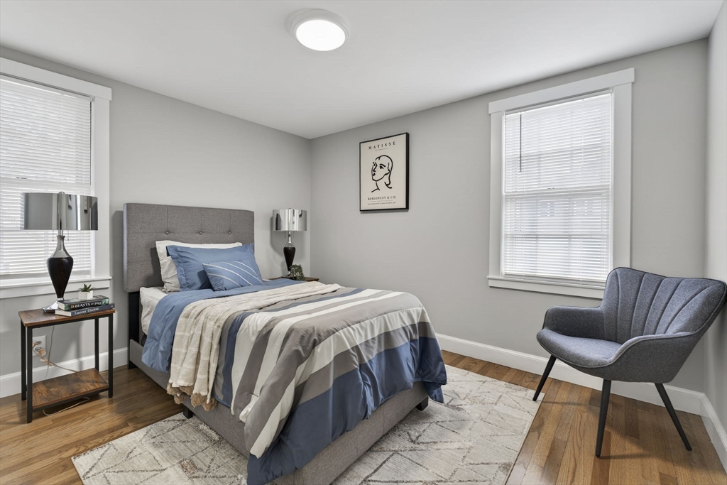 41 Clinton Street Marlborough, MA 01752 - Photo 17 of 26 a bedroom with a bed and a couch