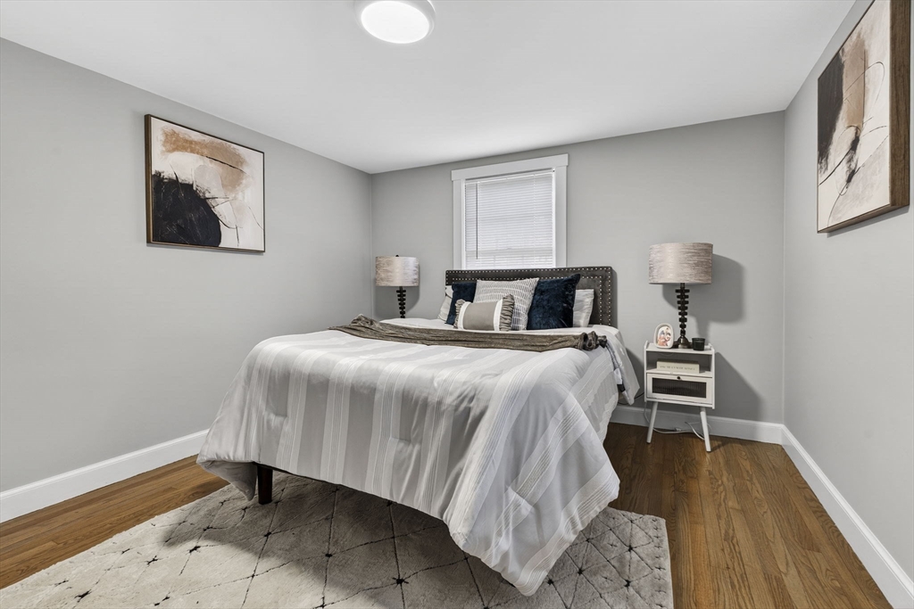 41 Clinton Street Marlborough, MA 01752 - Photo 21 of 26 a bedroom with a bed and a night stand