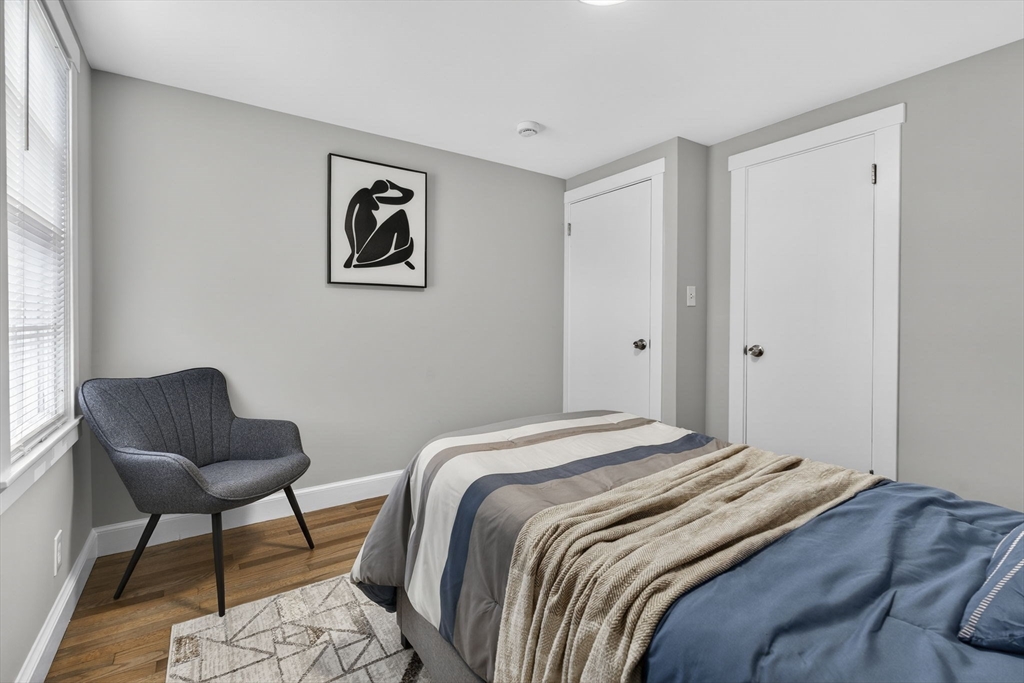 41 Clinton Street Marlborough, MA 01752 - Photo 22 of 26 a bedroom with a bed and chair