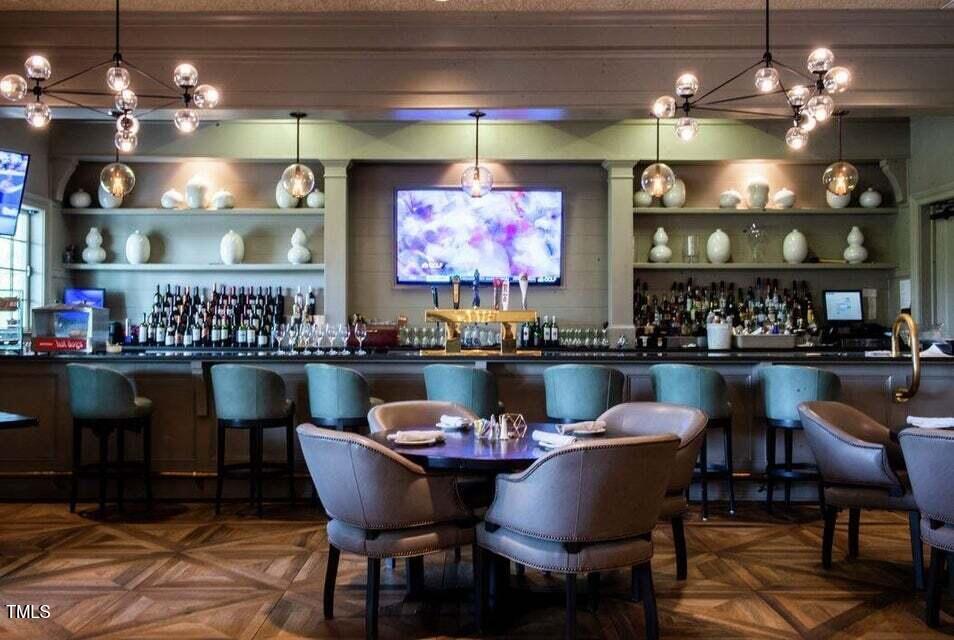 200 Regency Rdg Drive Apex, NC 27539 - Photo 21 of 39 a room with dining table and chairs