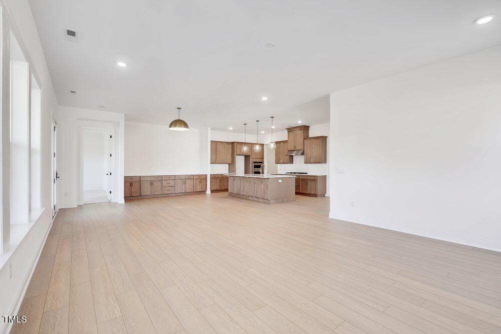 200 Regency Rdg Drive Apex, NC 27539 - Photo 4 of 39 a view of a kitchen with a sink and cabinets