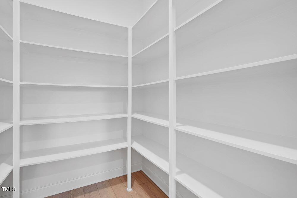 200 Regency Rdg Drive Apex, NC 27539 - Photo 6 of 39 a view of walk in closet with empty racks