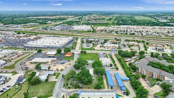 an aerial view of river residential houses with outdoor space and swimming pool