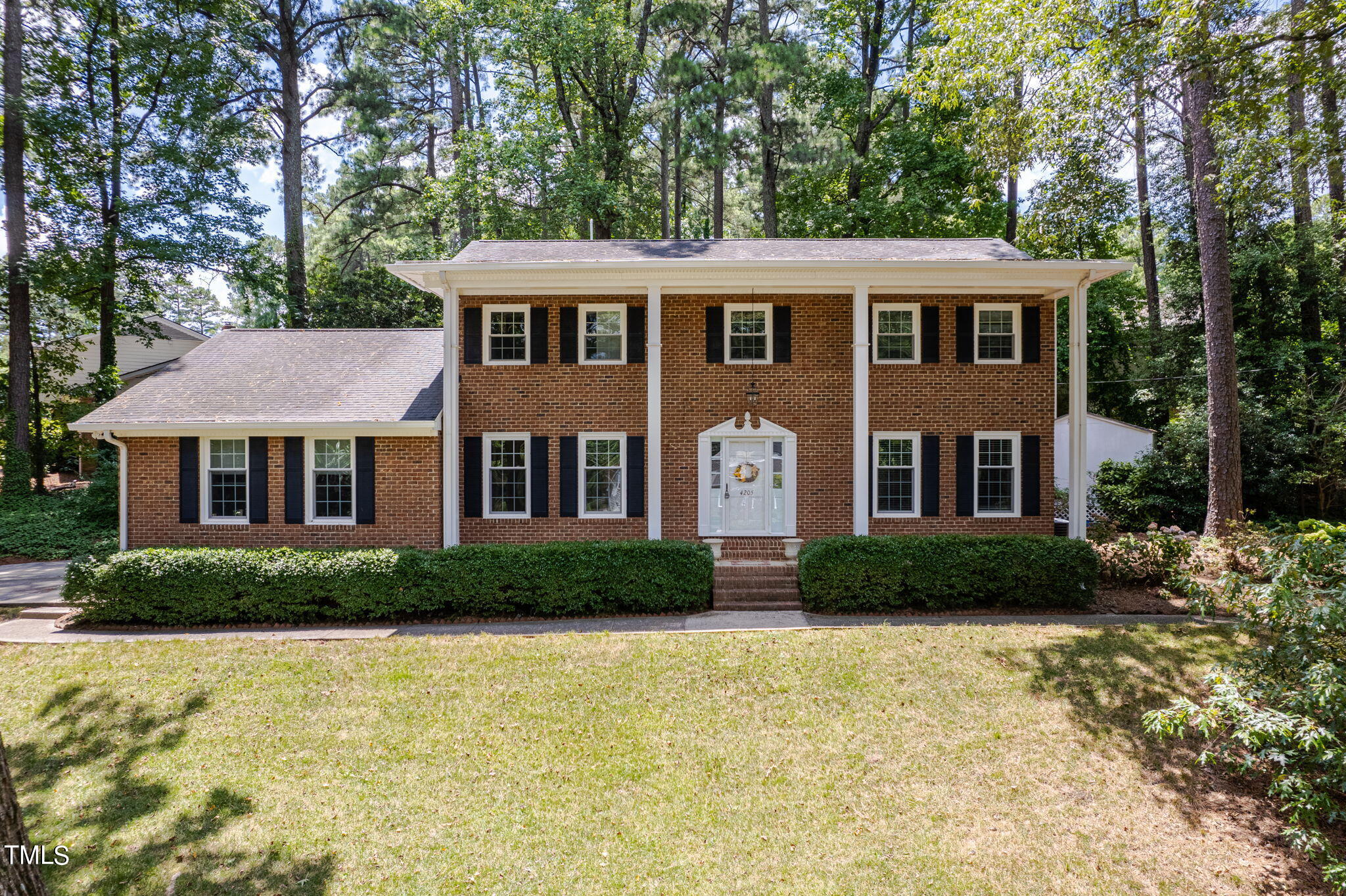 4205 Weaver Drive Raleigh, NC 27612 - Photo 1 of 48 a front view of a house with a yard