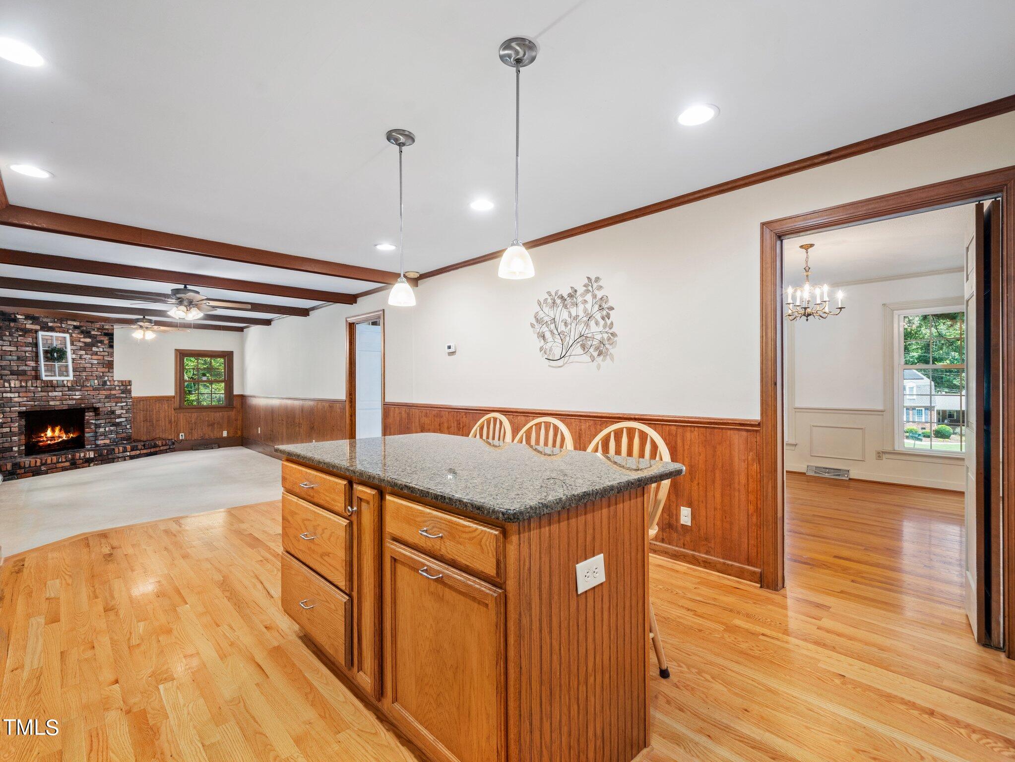 4205 Weaver Drive Raleigh, NC 27612 - Photo 17 of 48 a view of a hallway with furniture and wooden floor