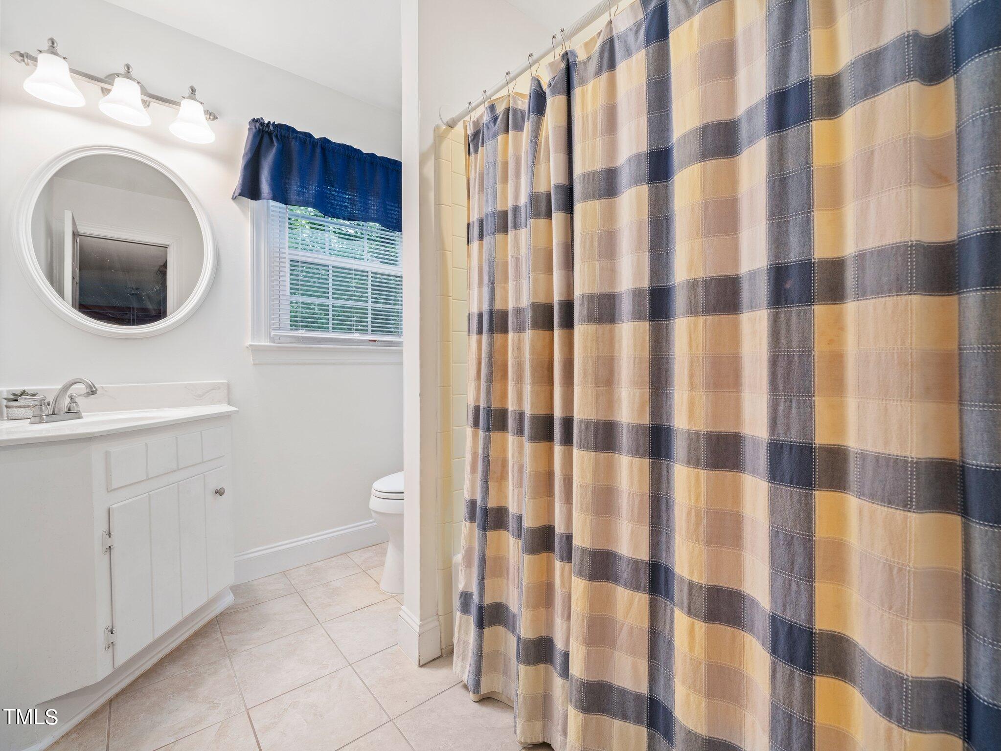 4205 Weaver Drive Raleigh, NC 27612 - Photo 23 of 48 a bathroom with a sink toilet and shower