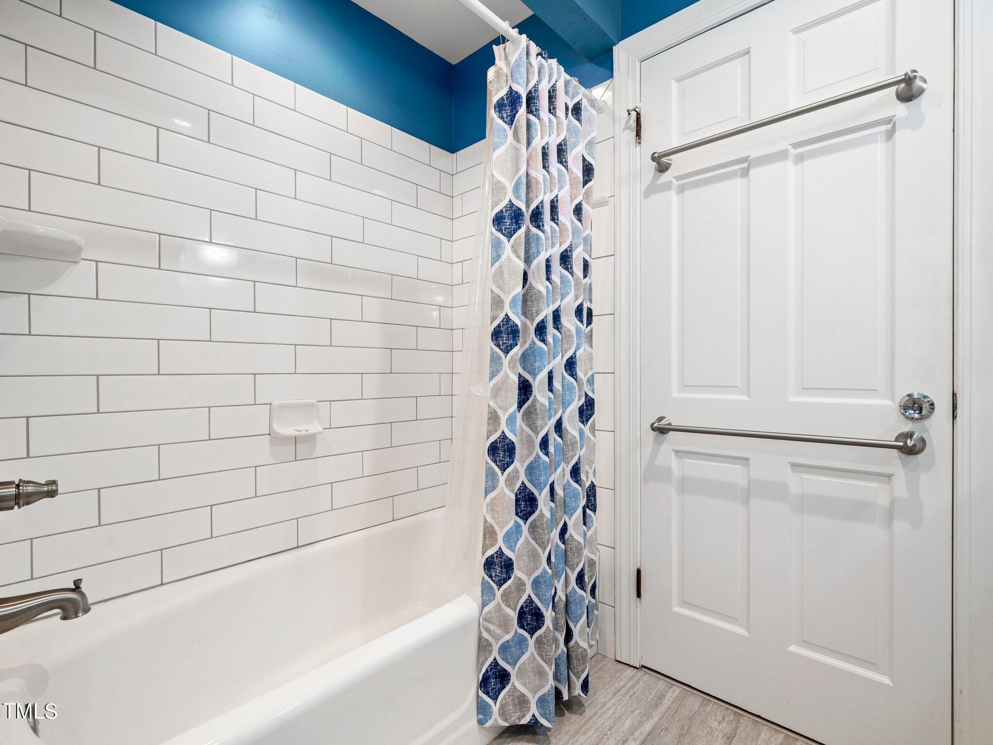 4205 Weaver Drive Raleigh, NC 27612 - Photo 29 of 48 a bathroom with a bathtub and shower