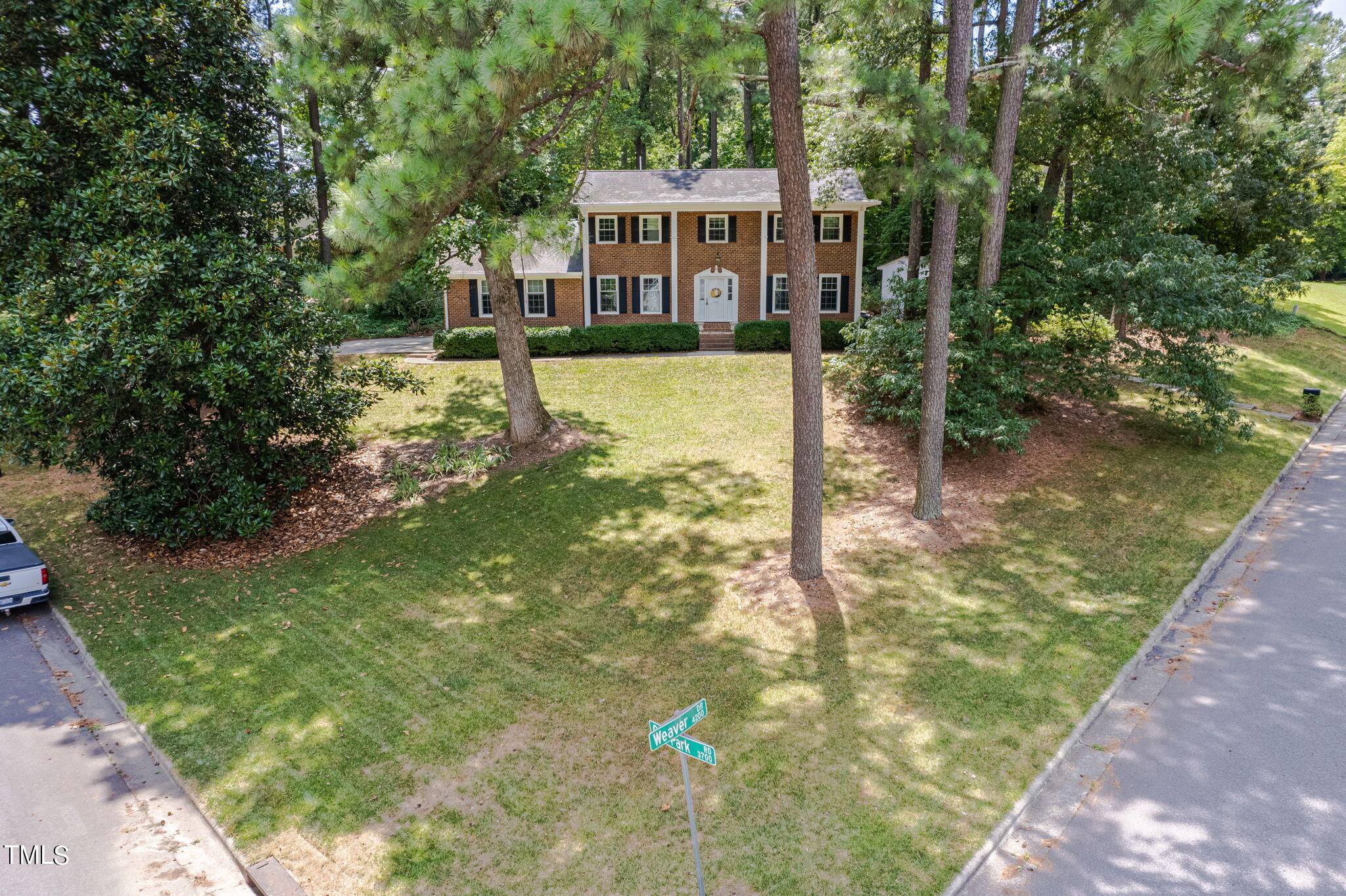 4205 Weaver Drive Raleigh, NC 27612 - Photo 3 of 48 a view of a lake with a building in the background