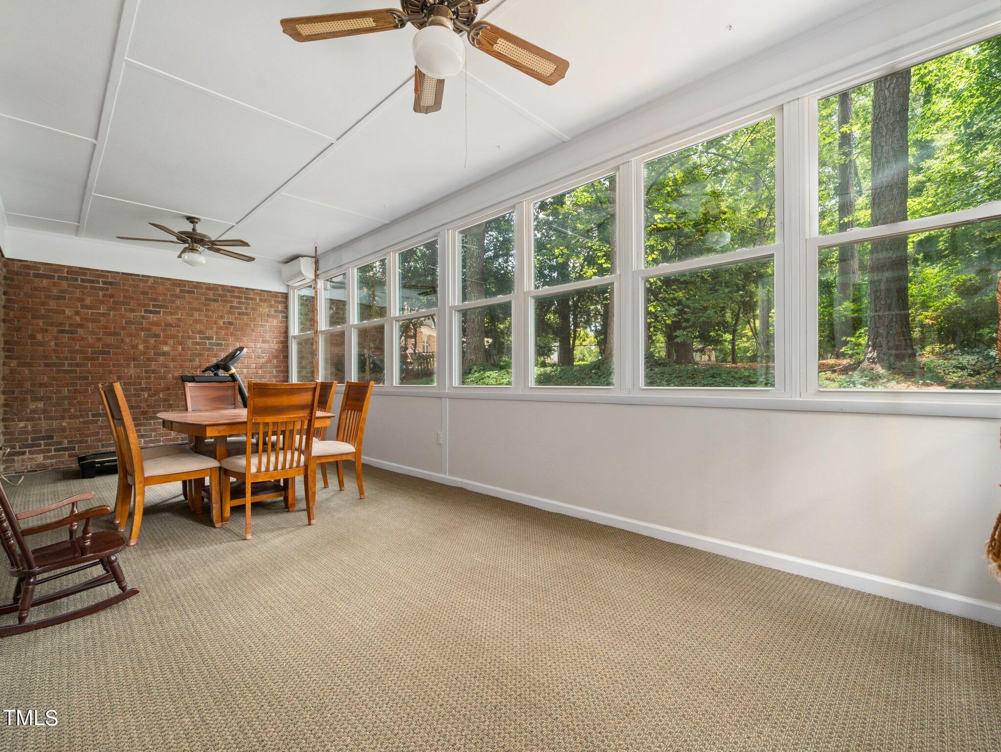 4205 Weaver Drive Raleigh, NC 27612 - Photo 33 of 48 a view of a workspace with furniture and a window