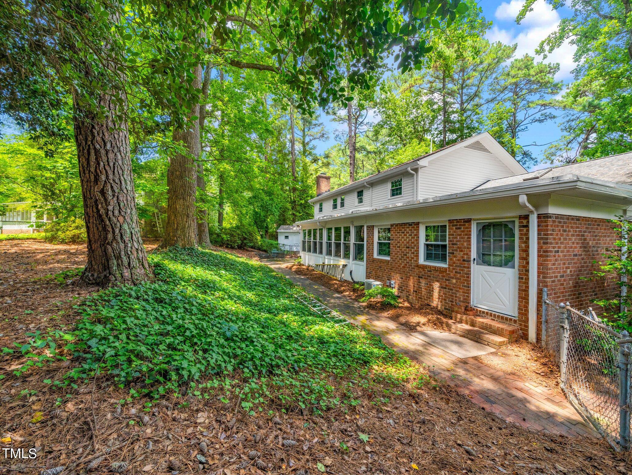 4205 Weaver Drive Raleigh, NC 27612 - Photo 39 of 48 a view of a house with a yard