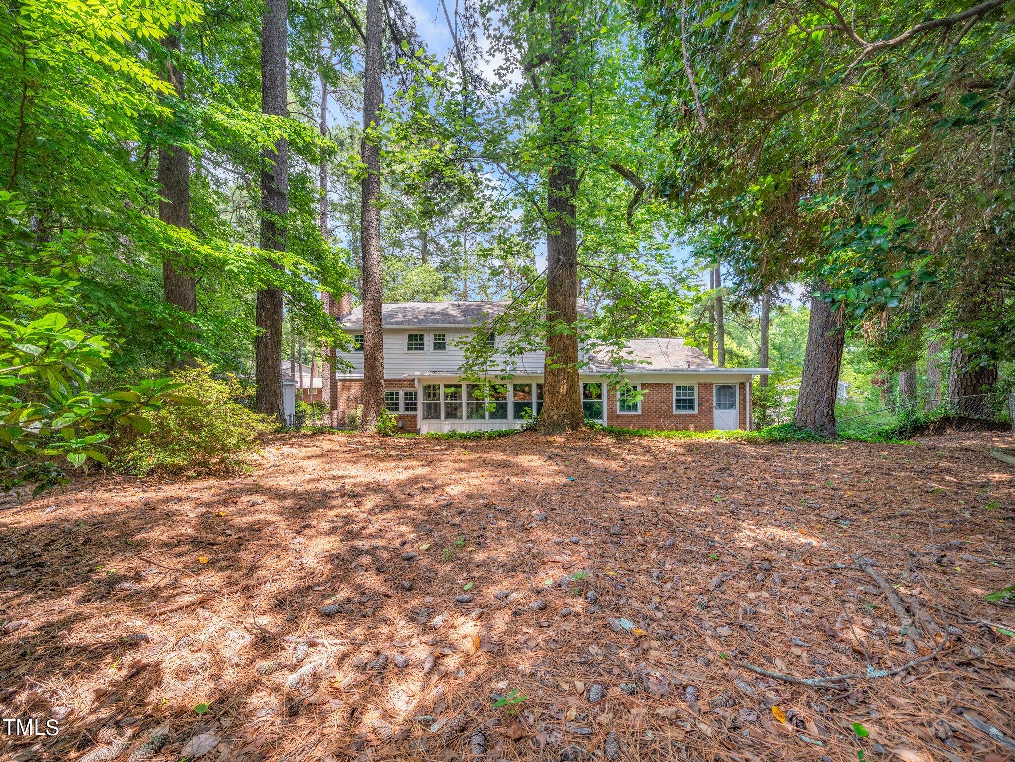 4205 Weaver Drive Raleigh, NC 27612 - Photo 40 of 48 a view of a house with a backyard