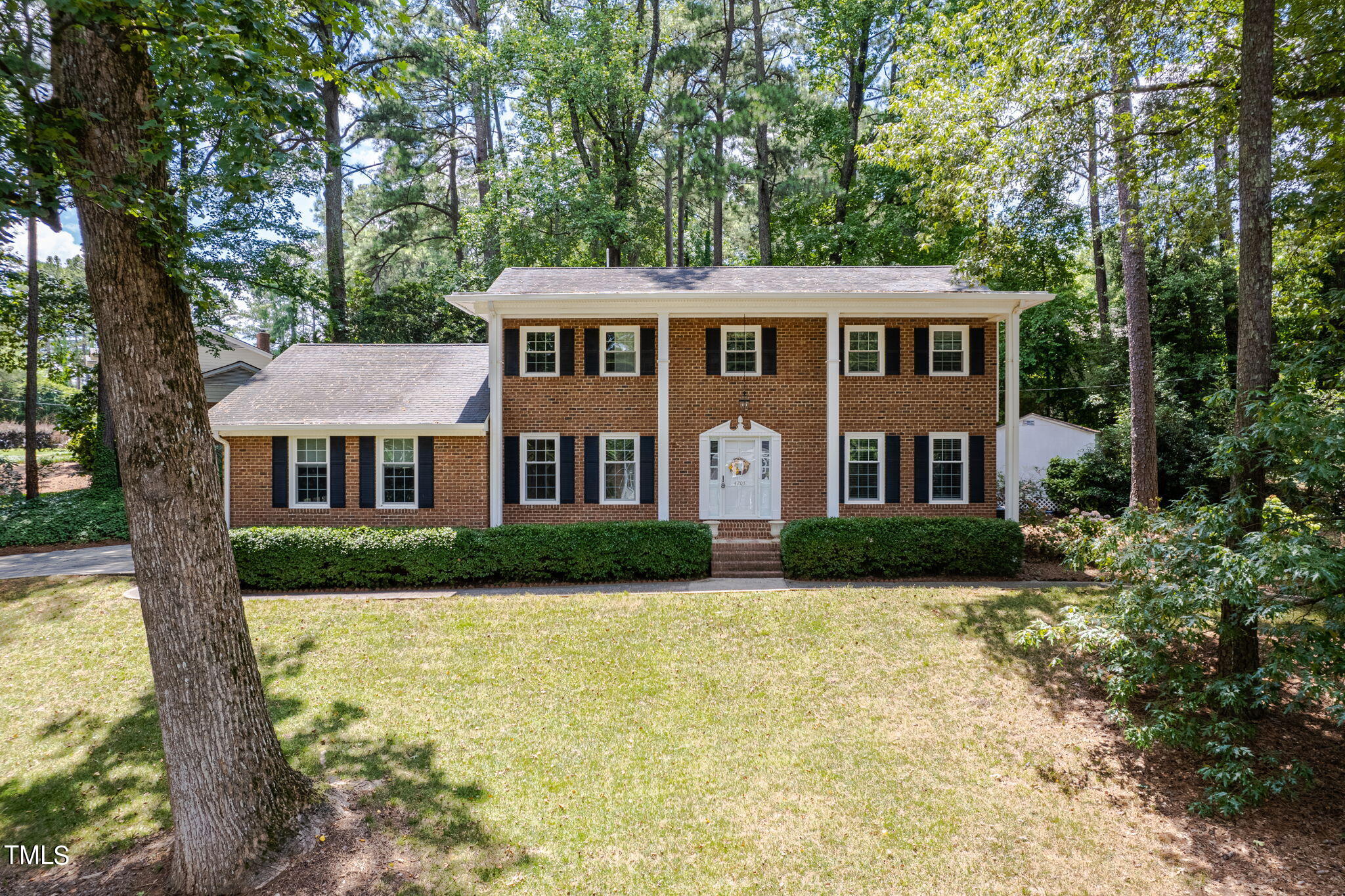 4205 Weaver Drive Raleigh, NC 27612 - Photo 4 of 48 a front view of a house with a yard